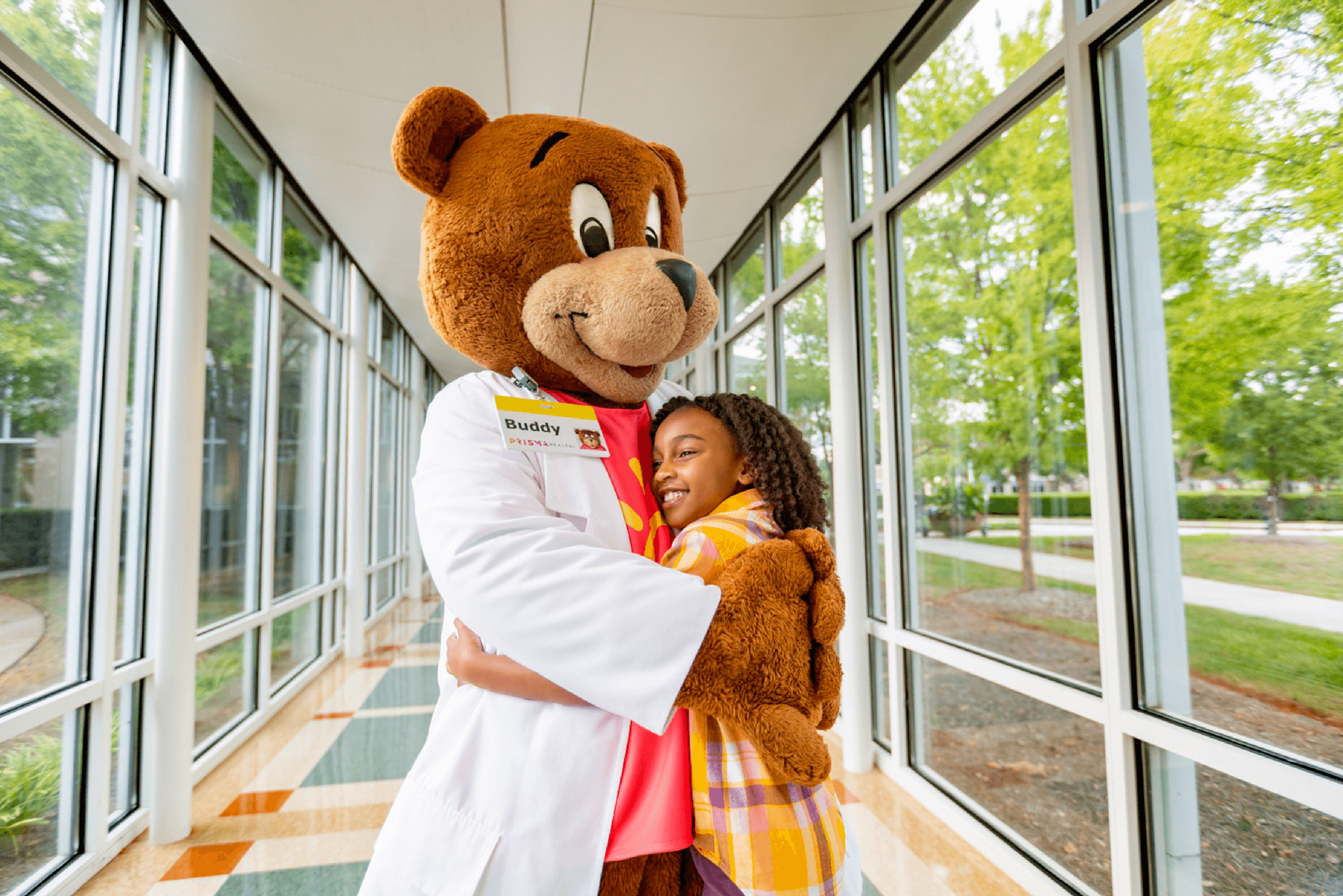 work_healthcare-pediatric-hospital-mascot-and-patient-hug-1.png