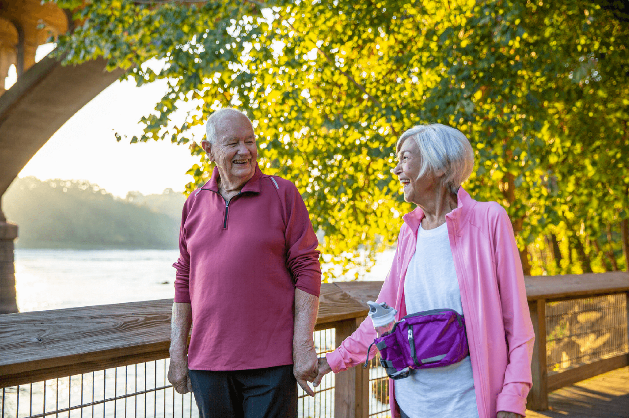 work_lifestyle-retired-couple-walking-riverside-1.png