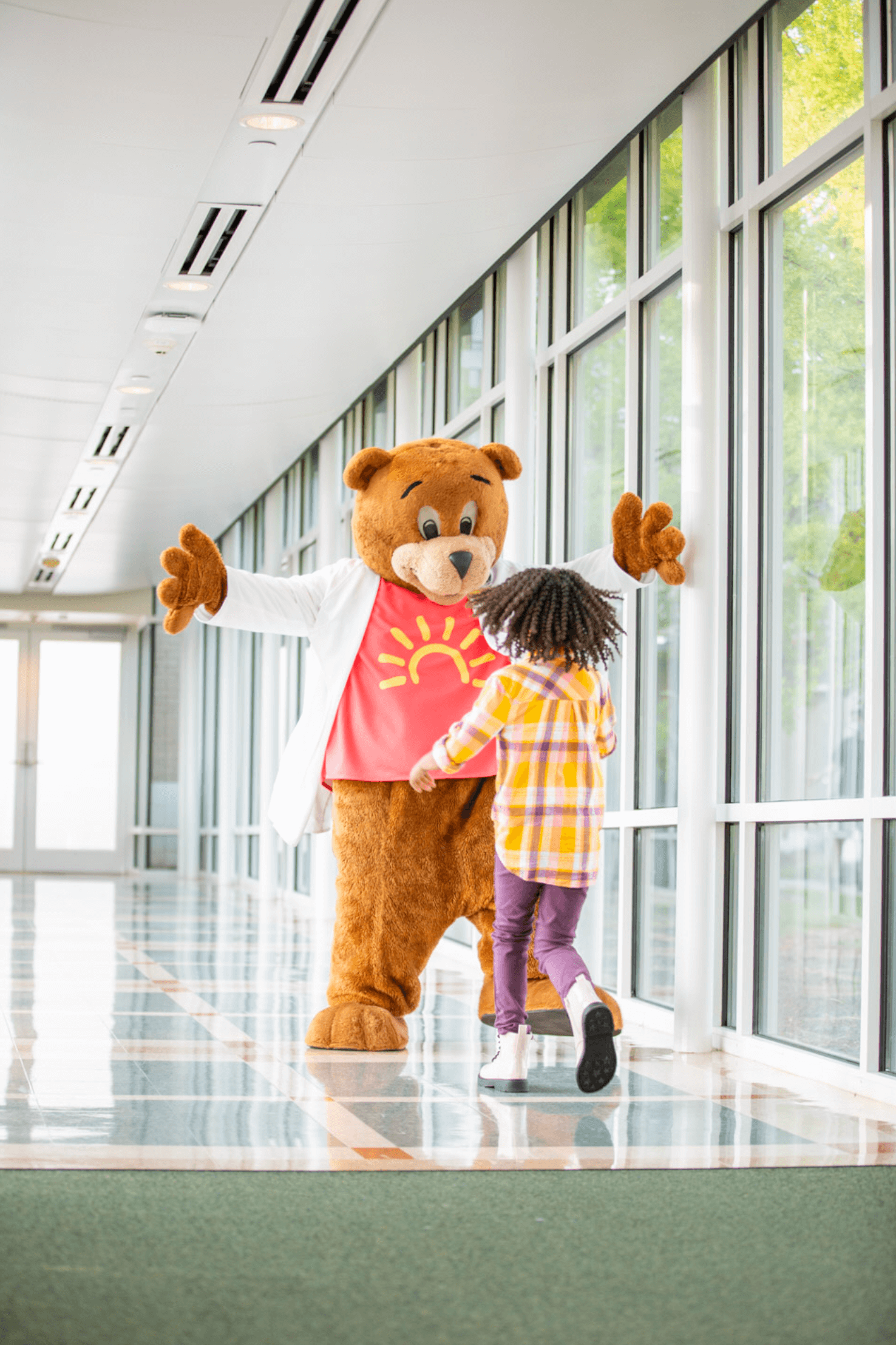 work_healthcare-pediatric-hospital-mascot-and-patient-hug-3.png