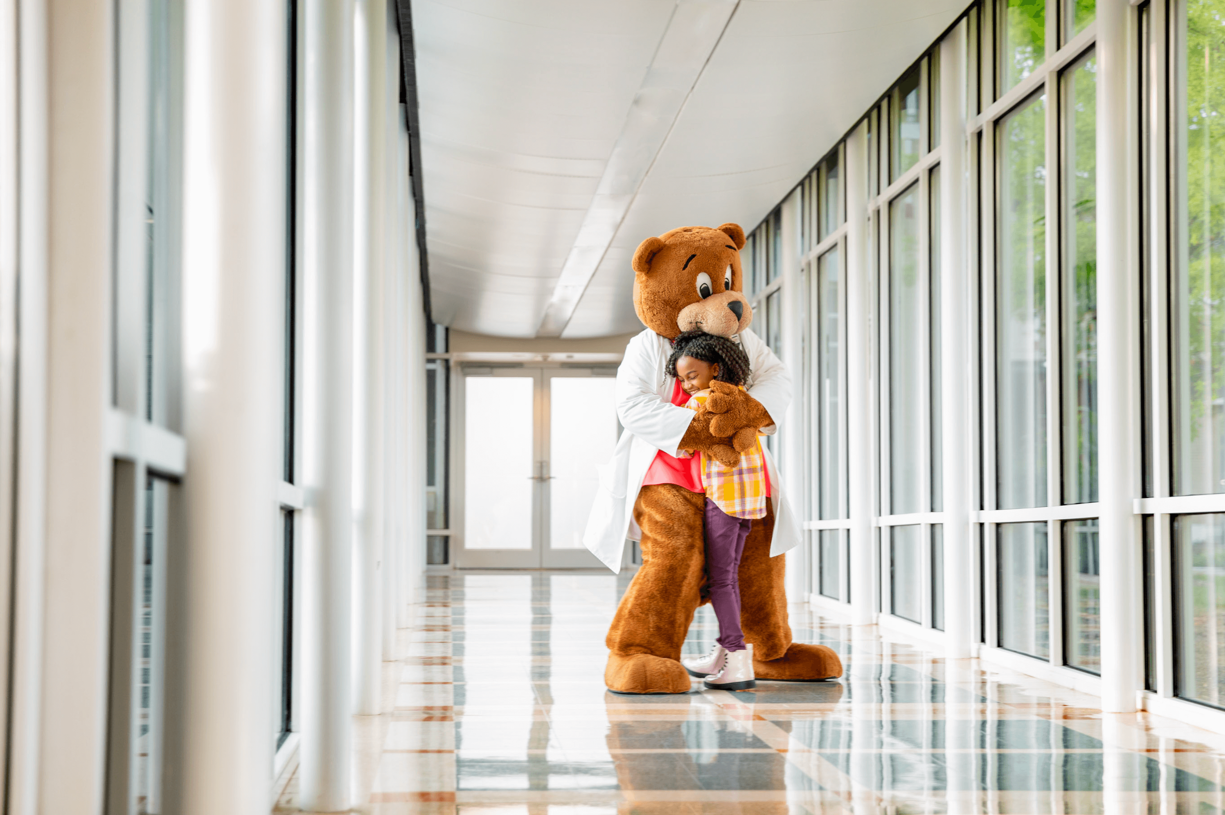 work_healthcare-pediatric-hospital-mascot-and-patient-hug-2.png