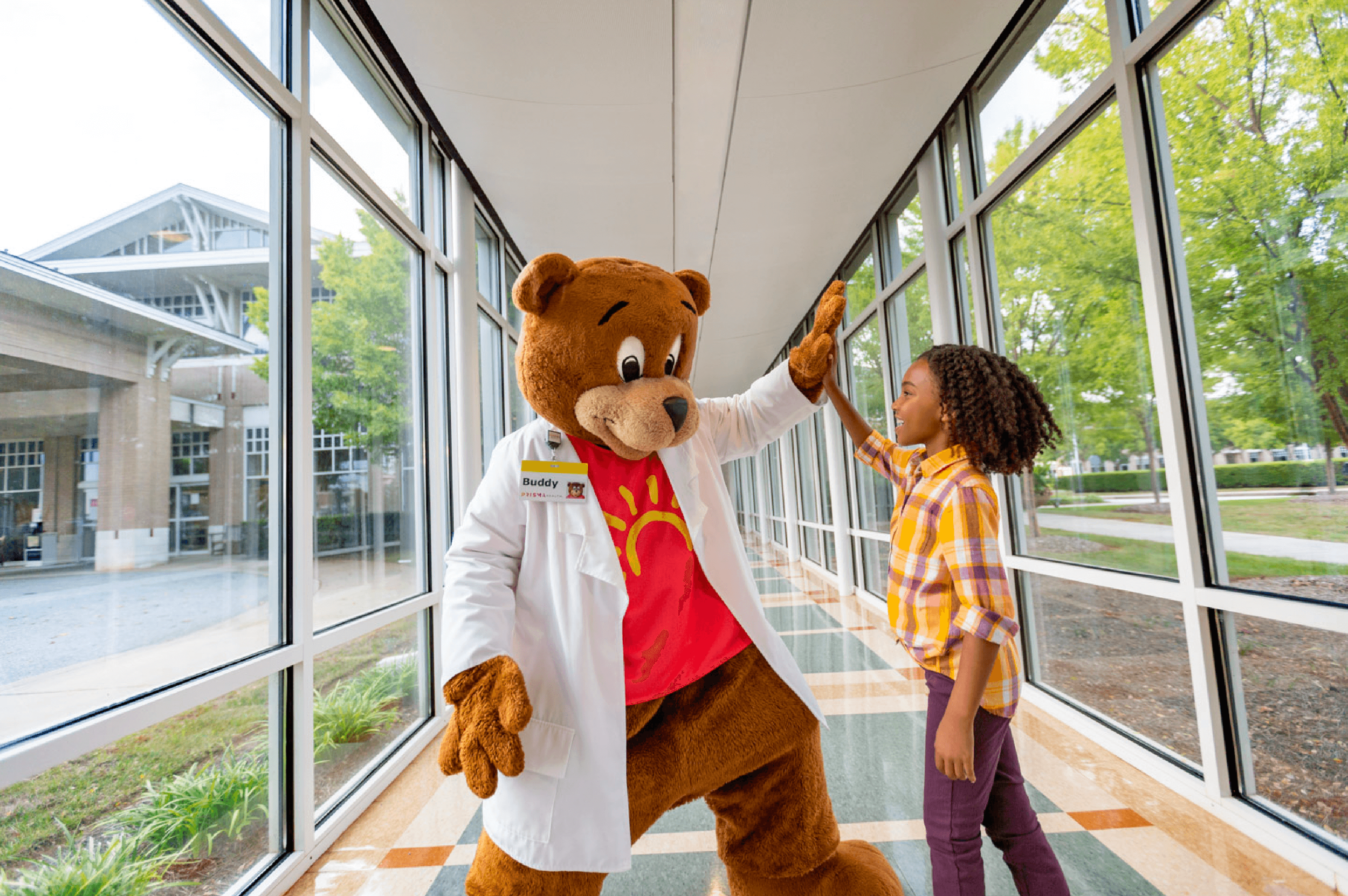 work_healthcare-pediatric-hospital-mascot-and-patient-high-five.png