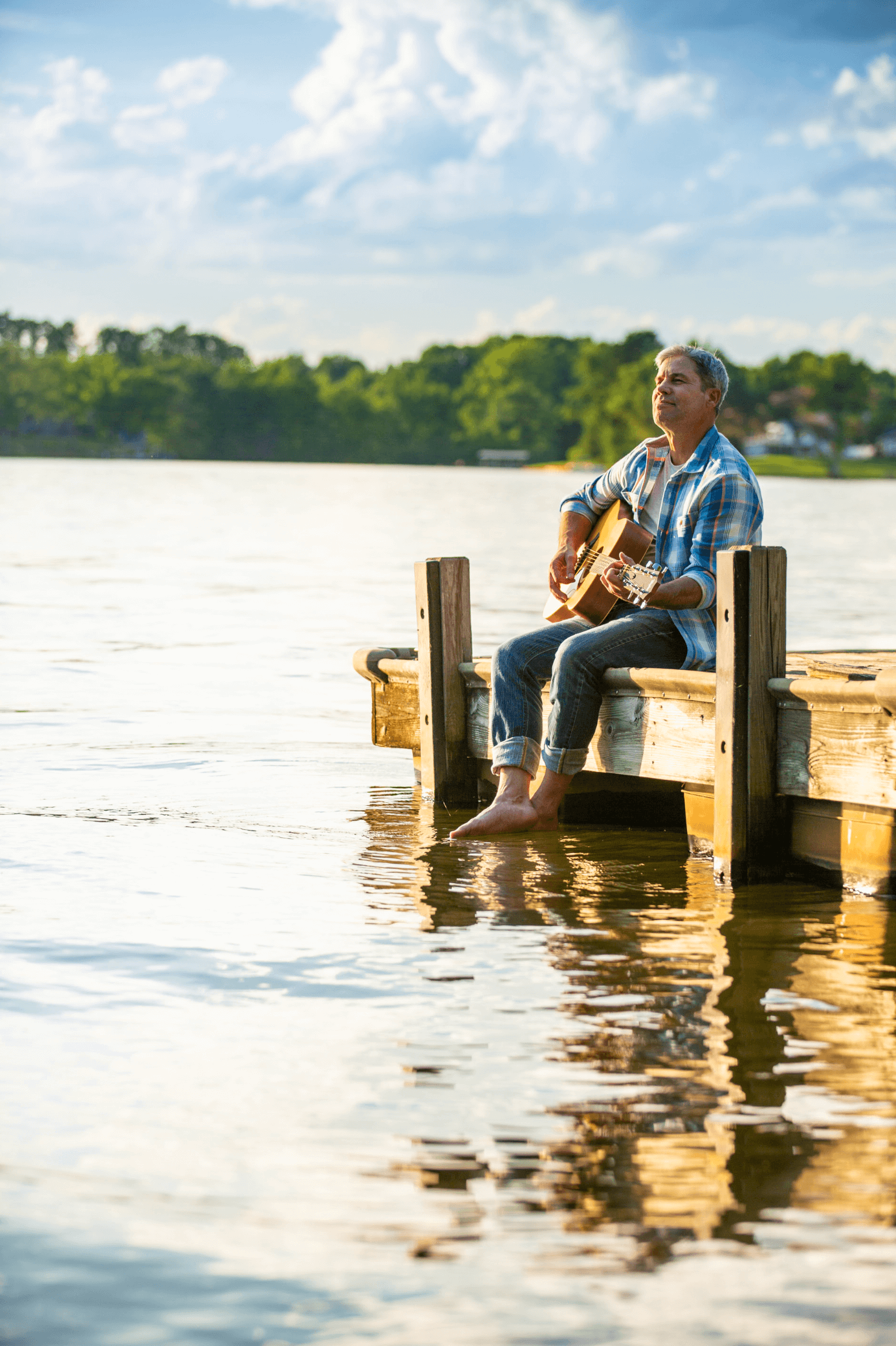 work_lifestyle-man-sitting-in-dock-playing-guitar-3.png