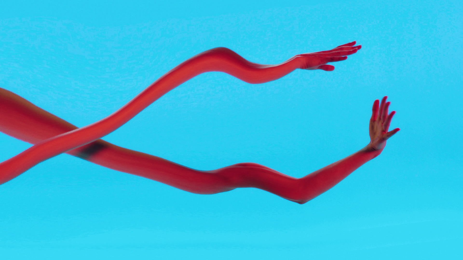 Two red human arms with hands extended forward against a blue background.