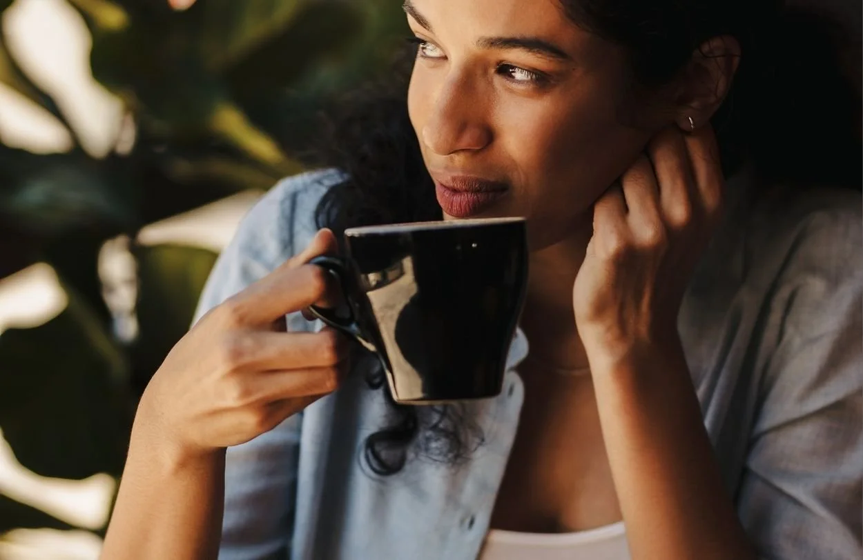 A woman sipping coffee