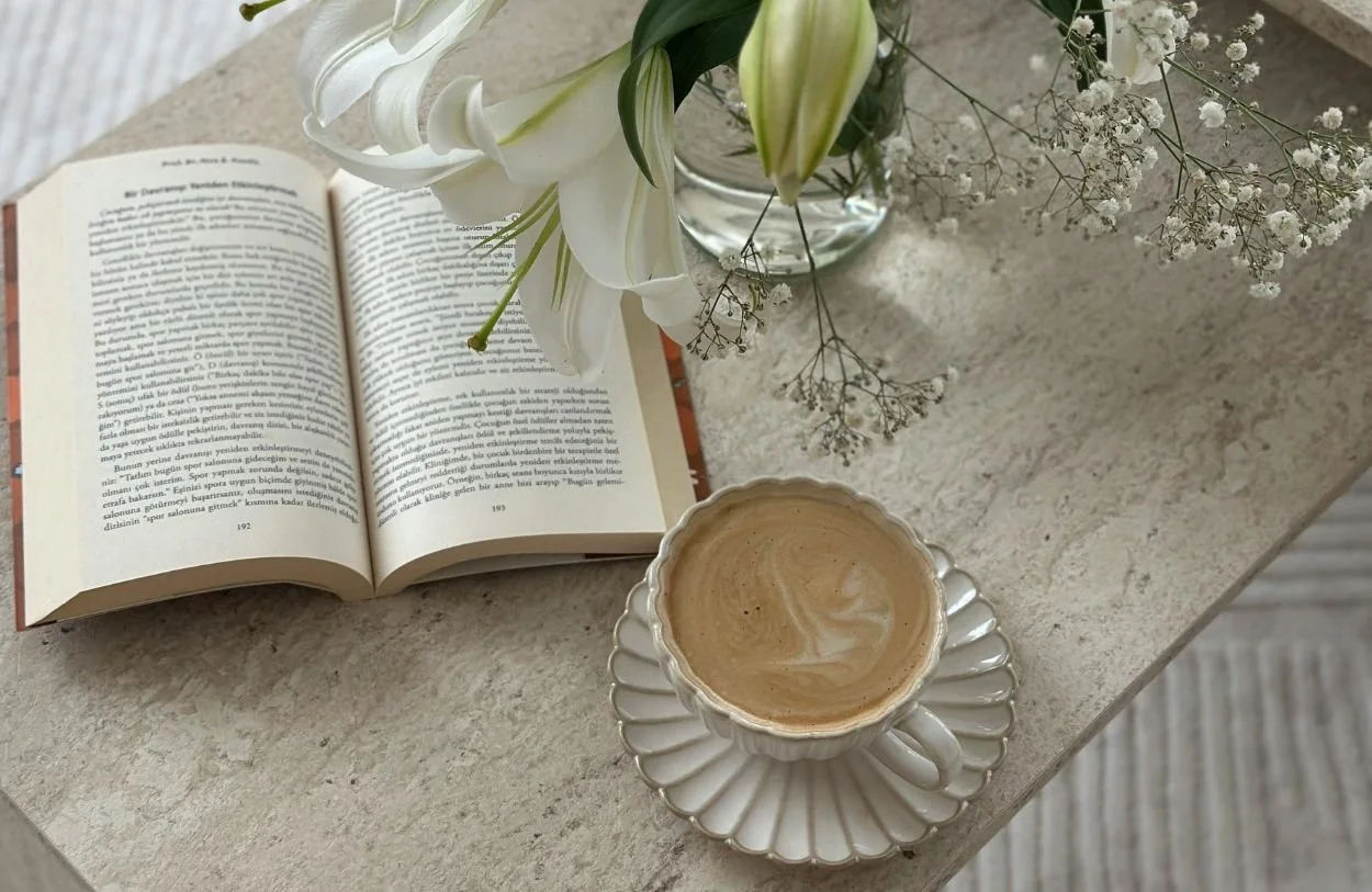 A book and coffee both used in couples therapy in Ottawa session