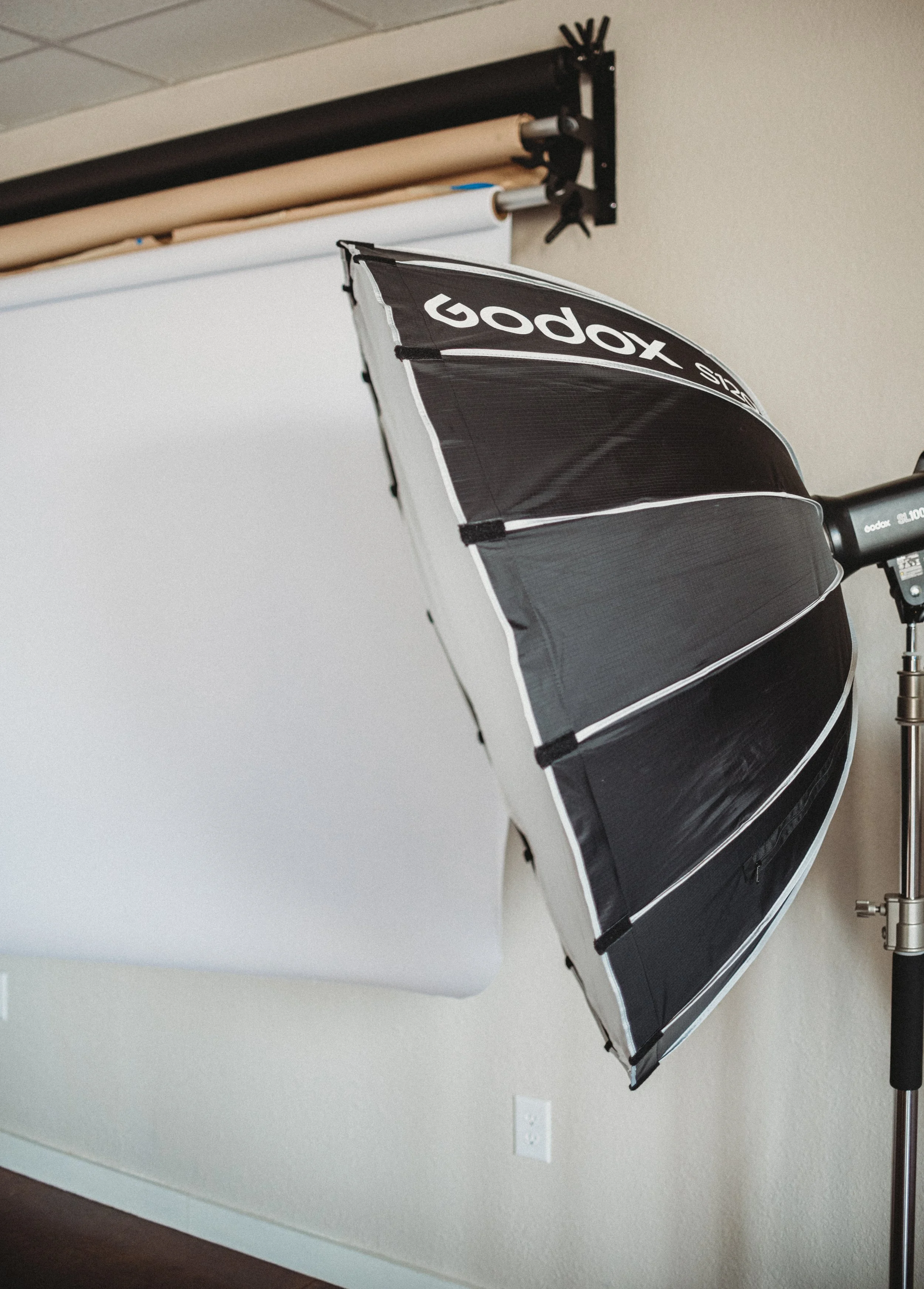 Professional softbox lighting equipment on a C-stand available for use at our photo studio for rent on the MS Gulf Coast.