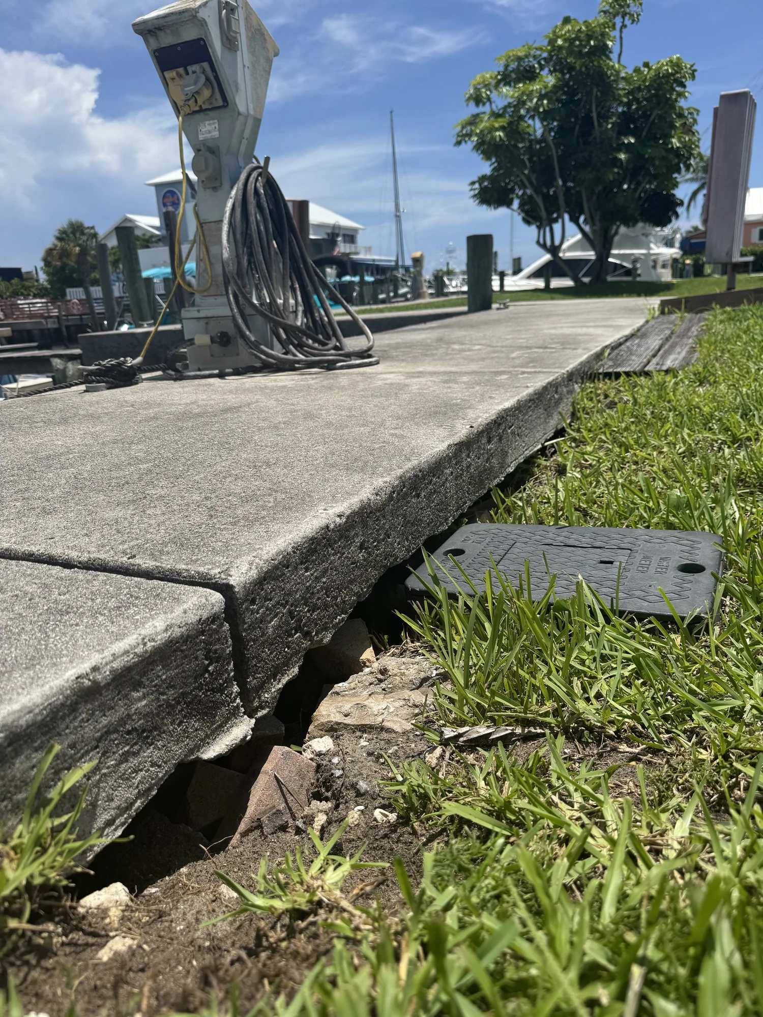 Erosion undermining a golf cart path in Florida after heavy rain