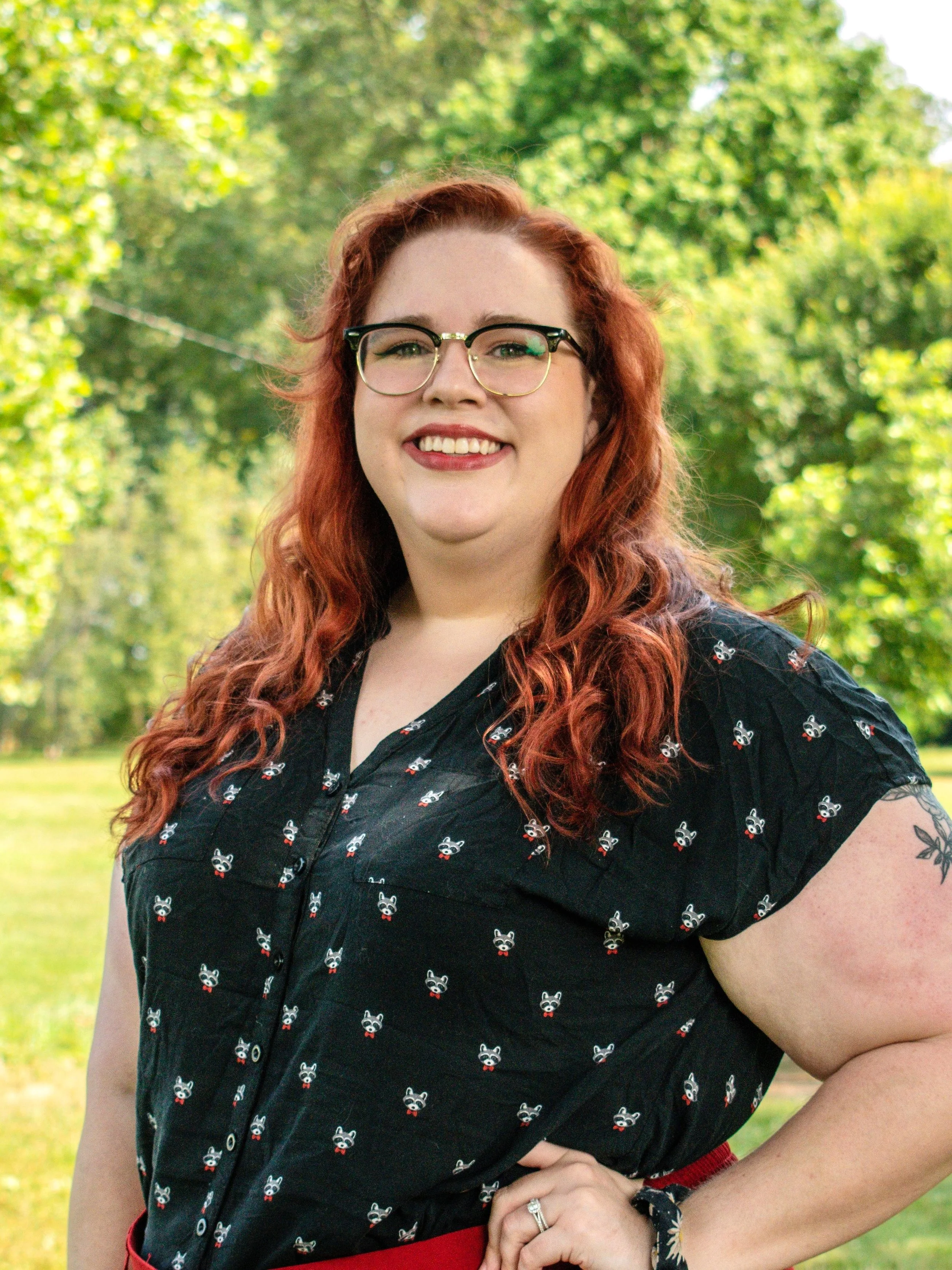 Portrait of Chelsea Blogna, outside with trees in the background