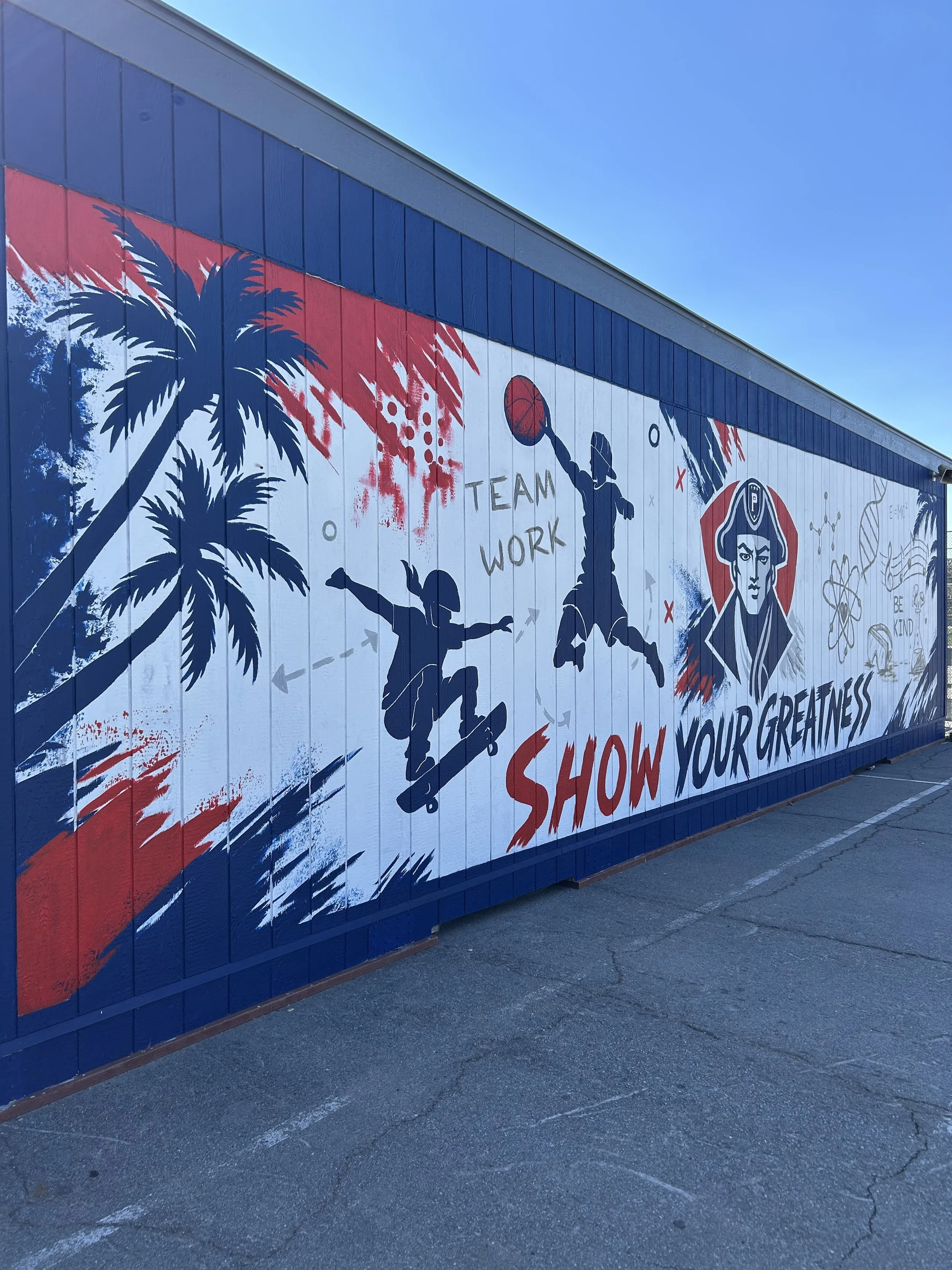 Parkway Academy red white and blue mural of Patriot mascot surrounded by skateboarder, basketball player mid jump and science equipment and math equations with a palm tree border