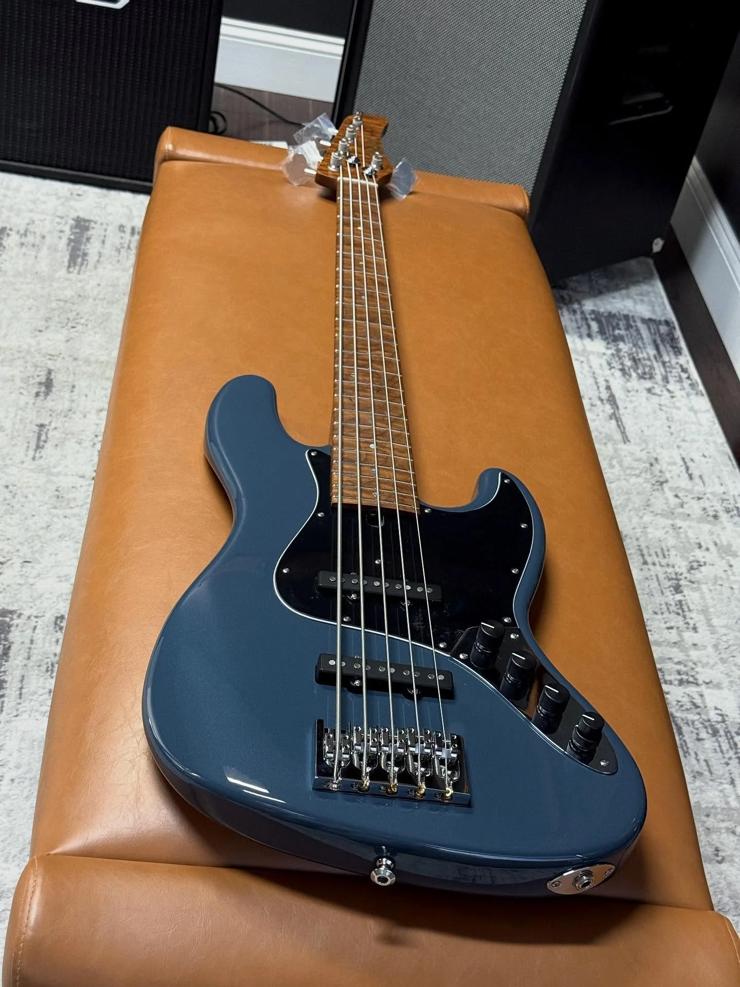Another one!  Just finished up this incredible M5V Custom in Porsche Pale Blue Metallic. Swamp Ash Body. Roasted Flamed Maple Neck and Fretboard (Abalone Dots). 8.5 lbs(!). Mike Lull Hand-Wound J Pickups. @trickfishamps IPA Preamp. 34&rdquo; Scale. A