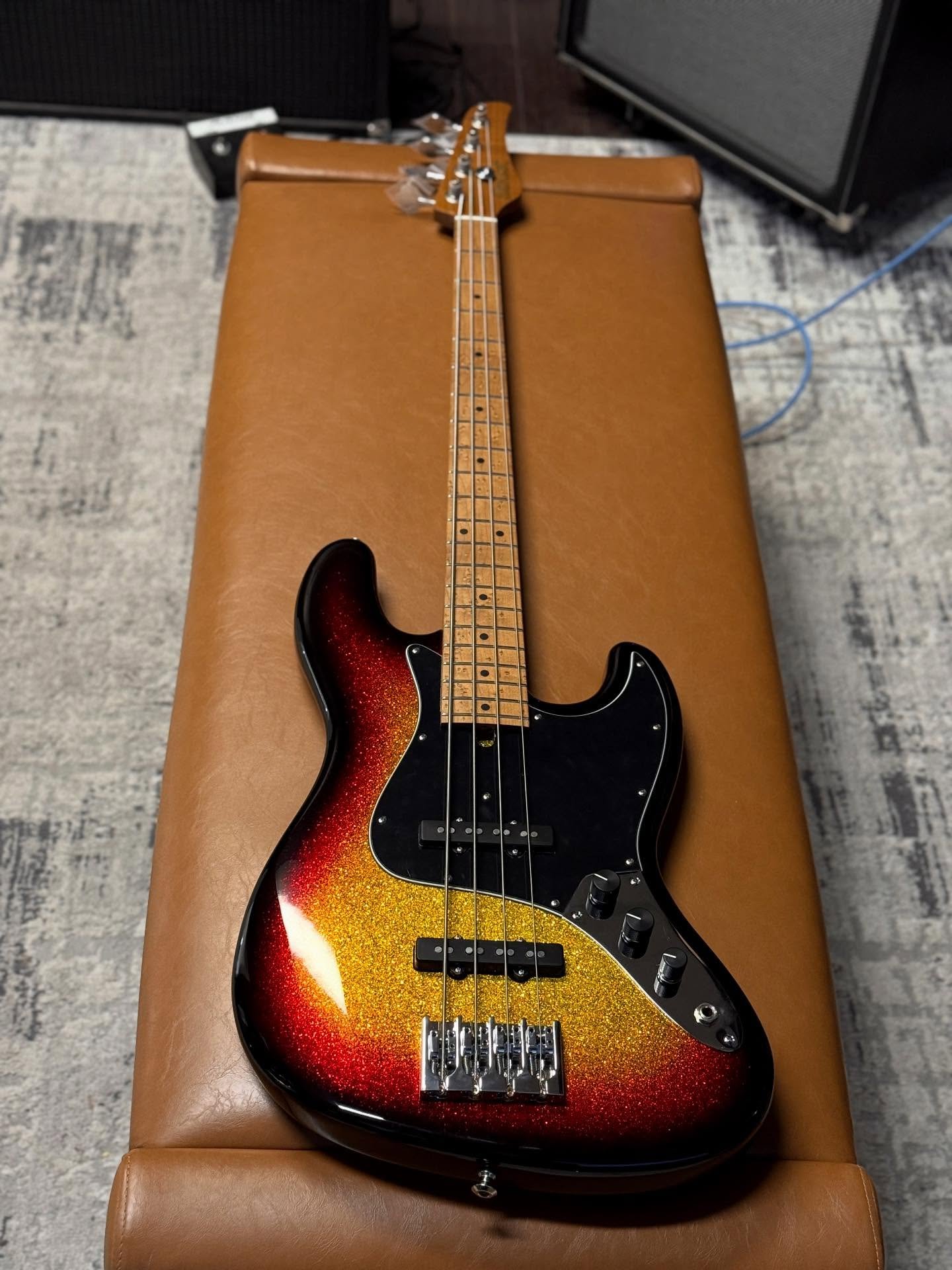 Just finishing up this V4 Custom in Three-Tone Chunky Sparkle 🔥🔥✨✨ One-Piece Light-Weight Swamp Ash Body. Quartersawn Roasted Maple Neck. Roasted Birdseye Maple Fretboard. Mike Lull Hand-Wound Pickups. Hipshot A-Style Bridge and Tuners. 8.2 lbs. In