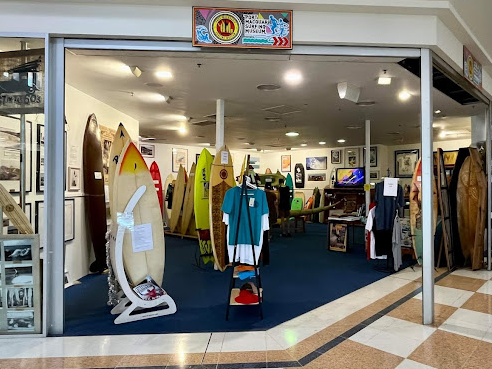 Surfboards and beachwear inside a surf shop