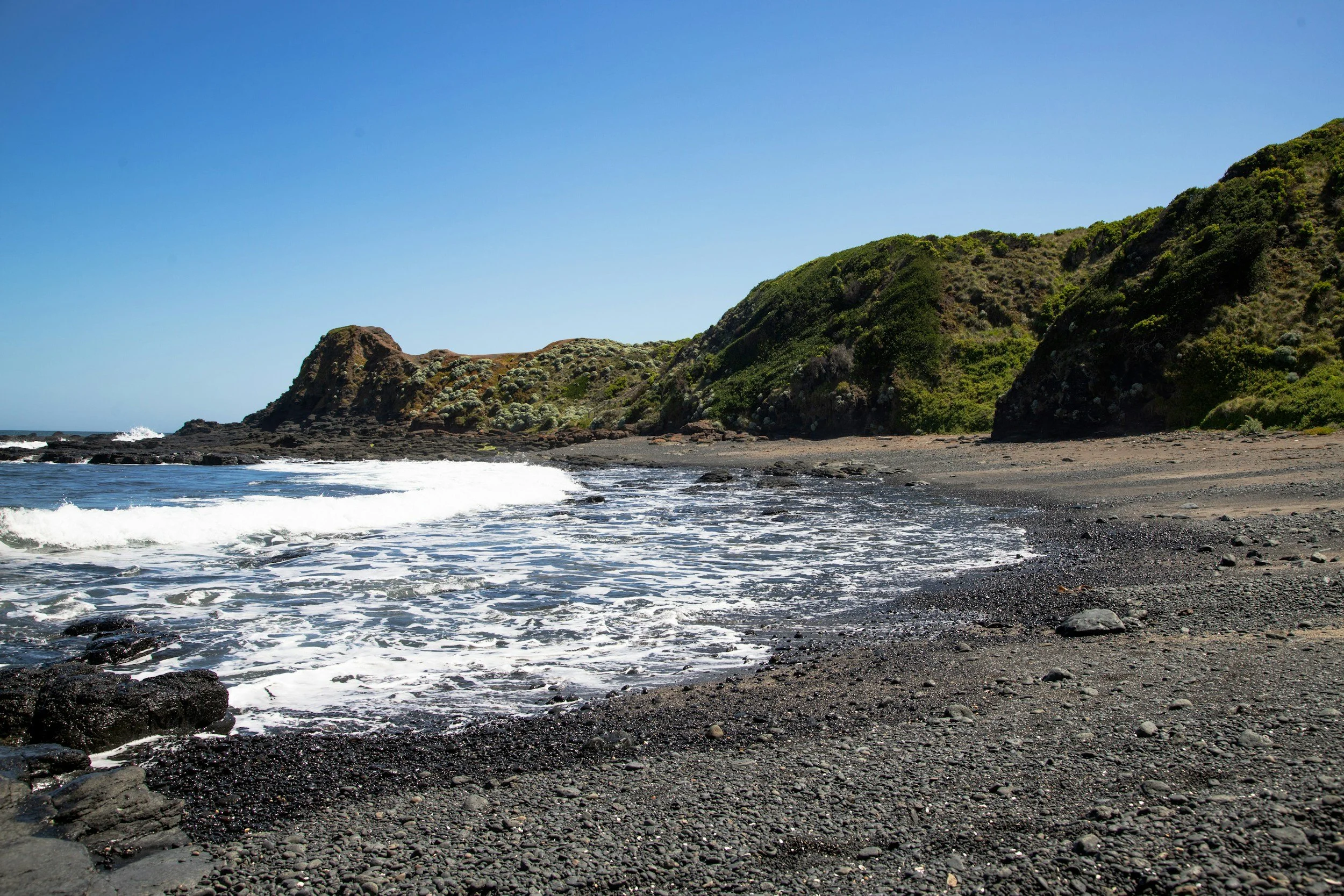 Rocky beach and headland on a coastal walk