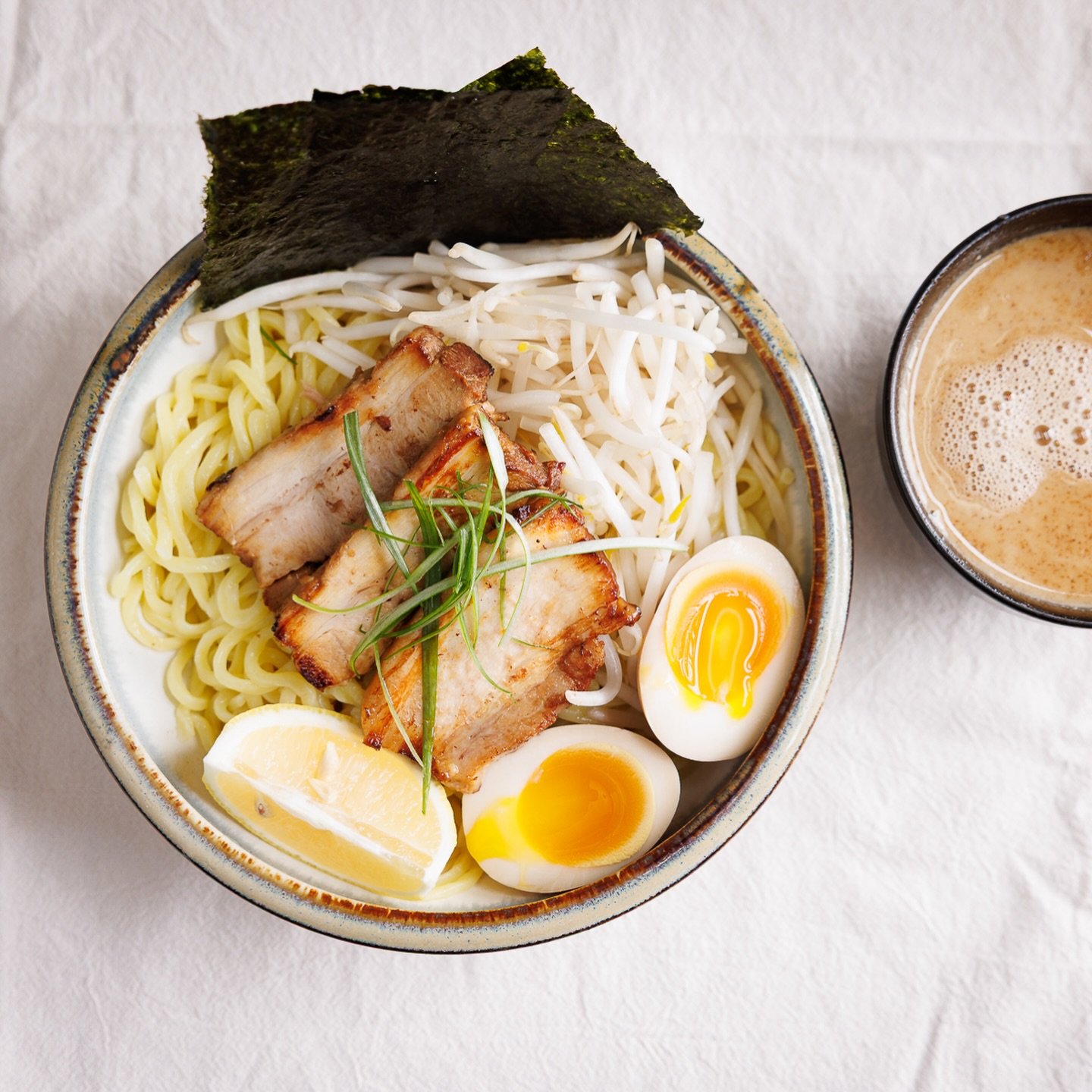 Dip into the ultimate ramen experience at Hinata Ramen! 🍜✨
Our Tsukemen isn&rsquo;t just a meal; it&rsquo;s a ritual. We serve up thick, chewy noodles perfectly paired with a bowl of our signature deep, rich dipping broth. Topped with melt-in-your-m