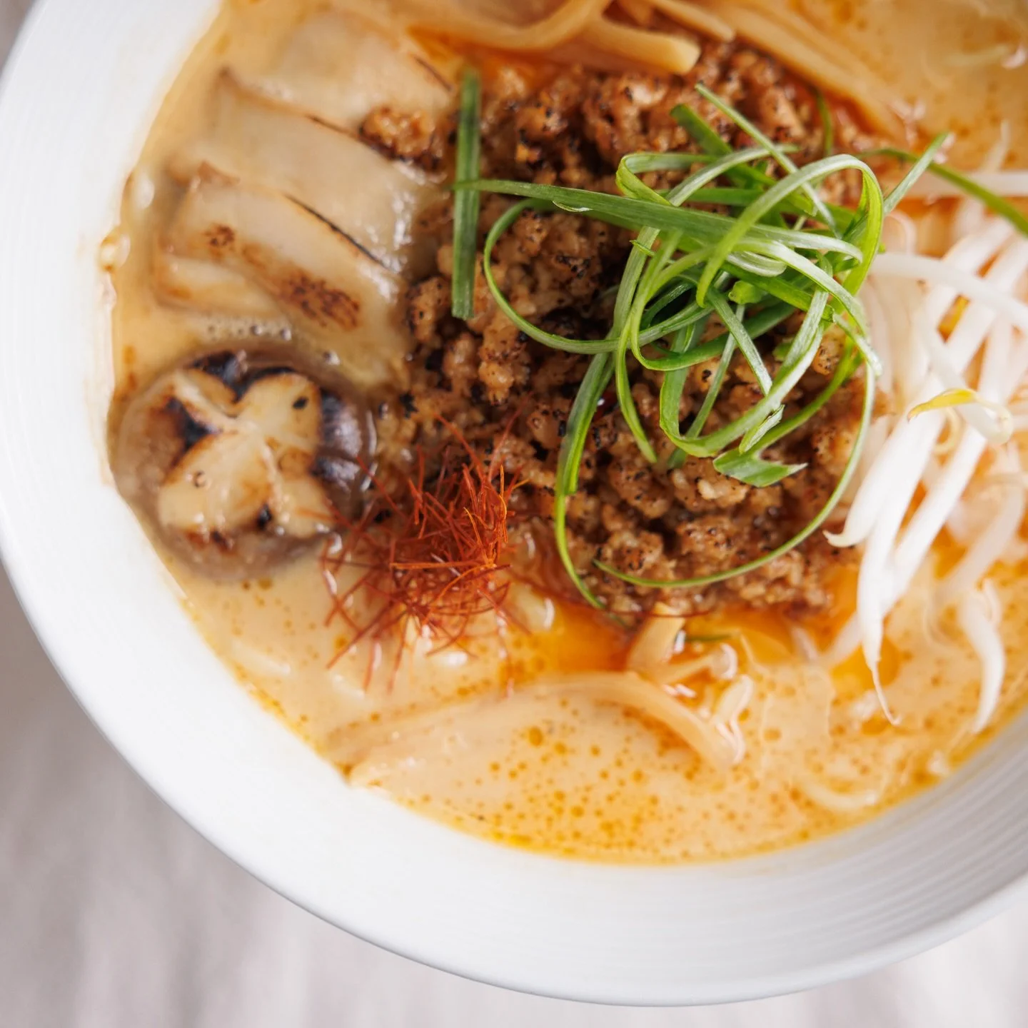 Our Pork Miso Ramen is a deep-broth masterpiece, packed with savory ground pork, snappy bean sprouts, bamboo shoots, and that signature king oyster mushroom. Whether you&lsquo;re diving into a steaming bowl or pairing it with our legendary Hibachi Fr