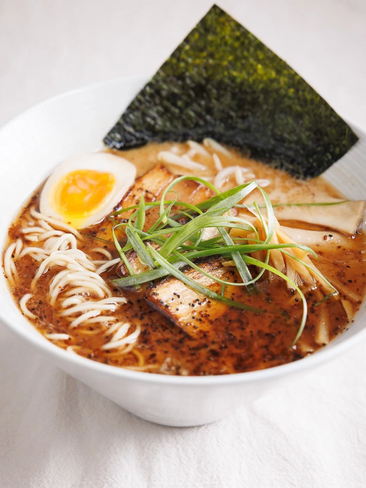 Dark, bold, and completely irresistible. 🖤 Our Black Garlic Ramen hits different. Chashu, king oyster mushrooms, bamboo shoot, and that signature black garlic oil &mdash; every bowl is a vibe.

🍜 Craft Ramen &amp; Hibachi Fried Rice
📍 4211 E Willo