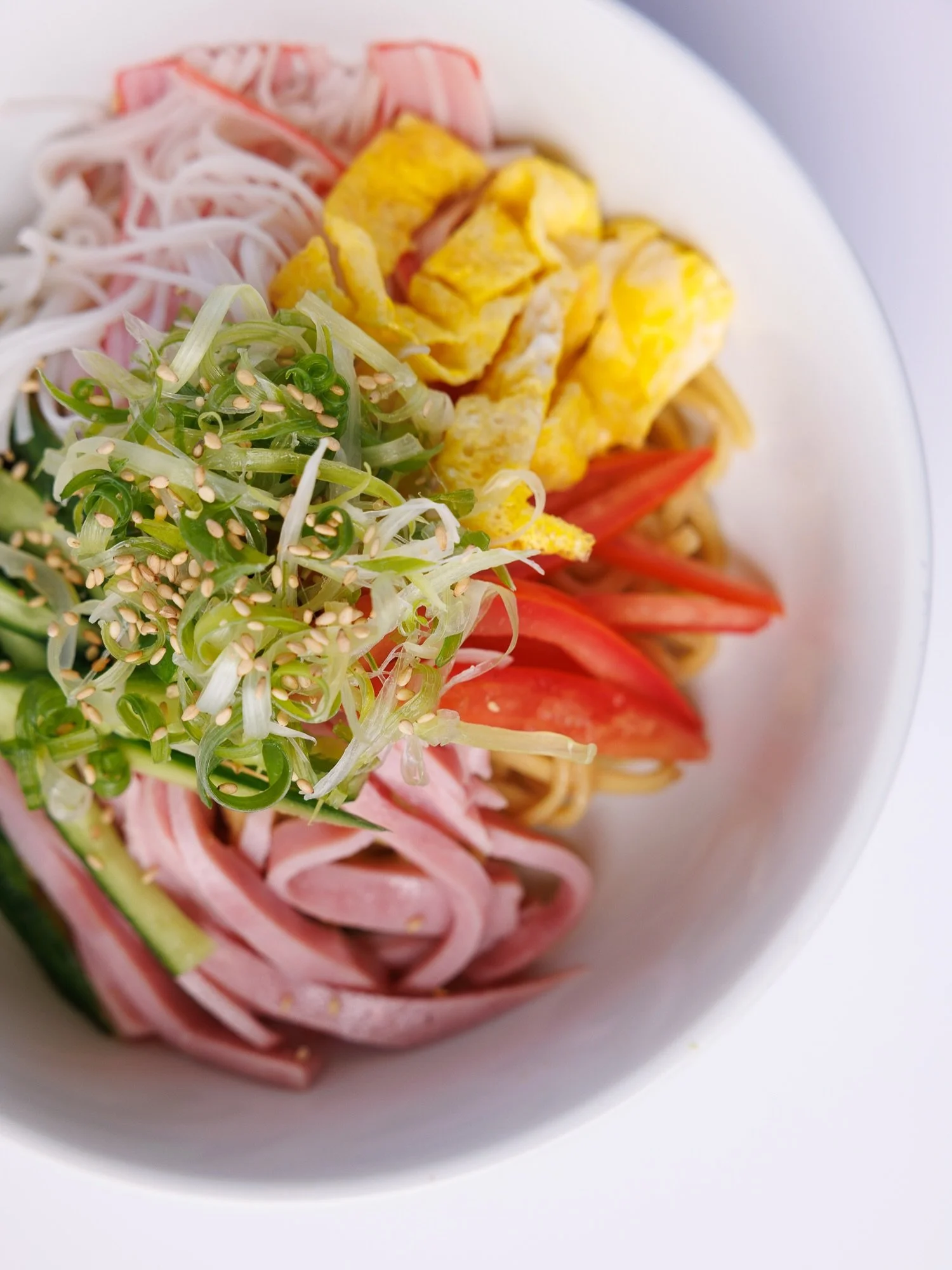 No broth. No heat. Just summer in a bowl. Hiyashi Chuka &mdash; cold noodles tossed in savory sesame sauce with crab stick, cucumber, egg, tomato, and ham. Already dressed. Already perfect. Pair it with a cold draft Kirin and you&rsquo;re done. Cold 