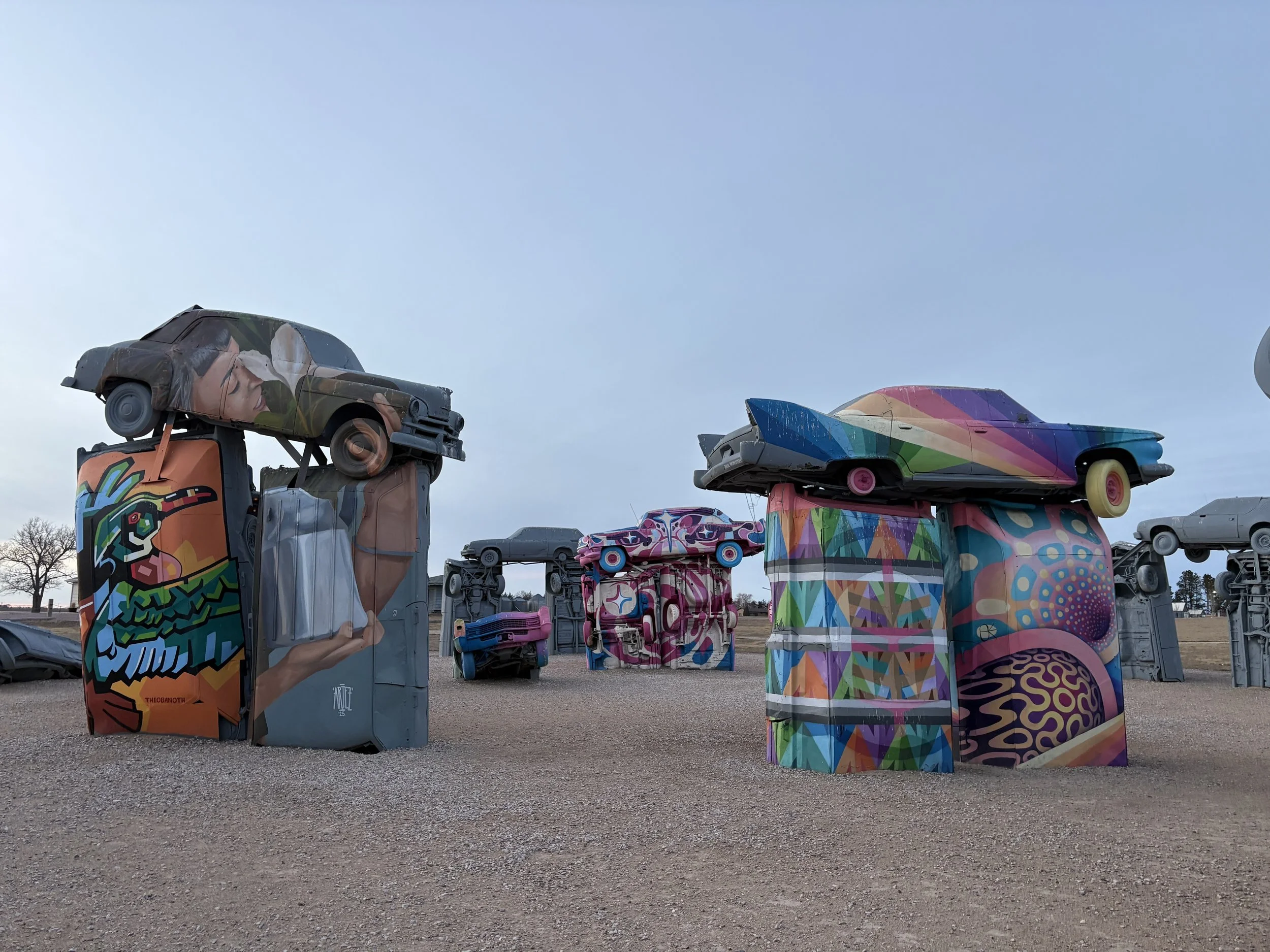 Murals painted in 2026 at Carhenge left to right: The Obanoth, Artez, Chanate, Key Detail, Paul Monsters, Anna Charney