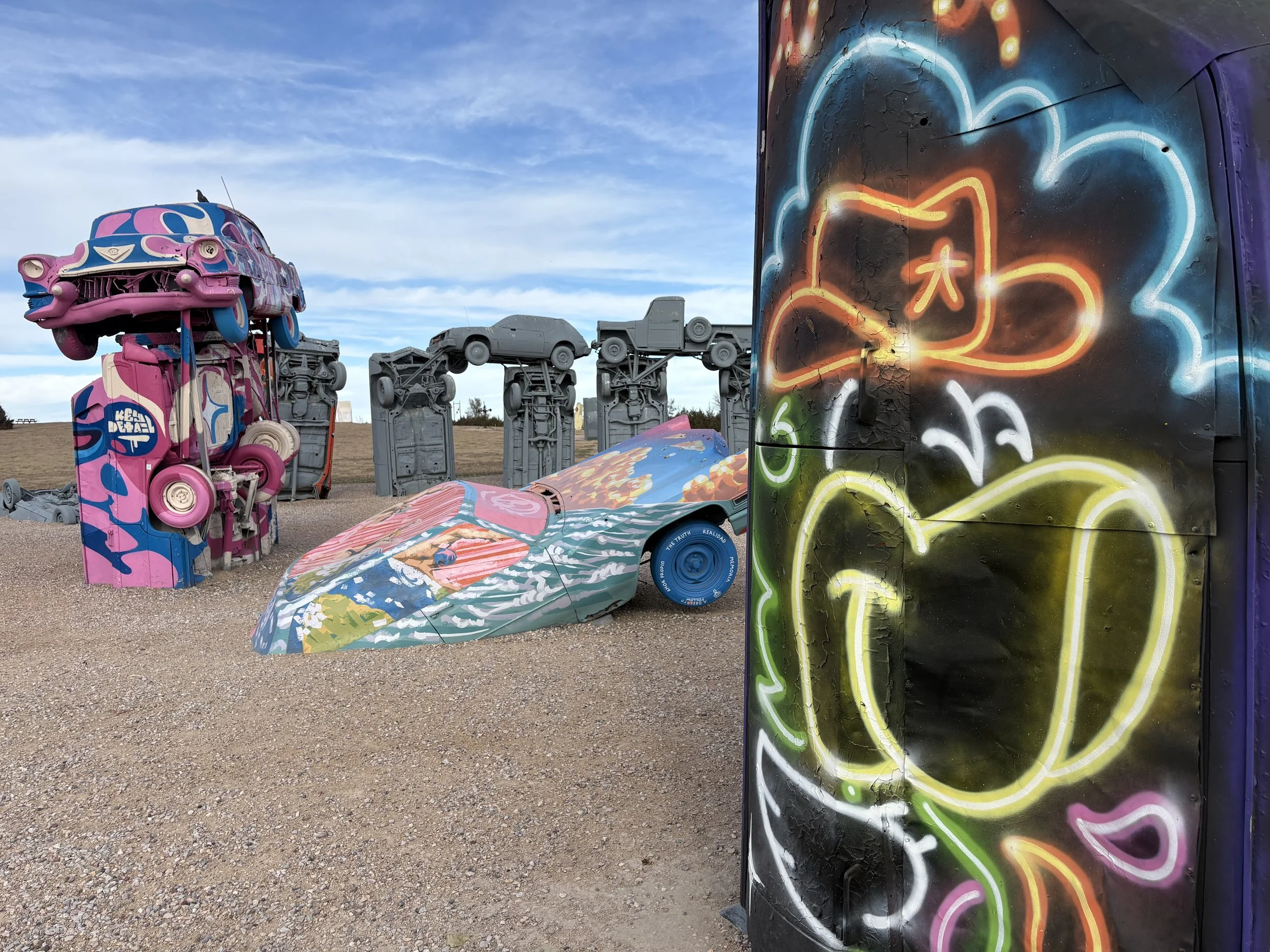 Murals painted in 2025 at Carhenge by Key Detail, Chanate, and Fat Cap Sprays