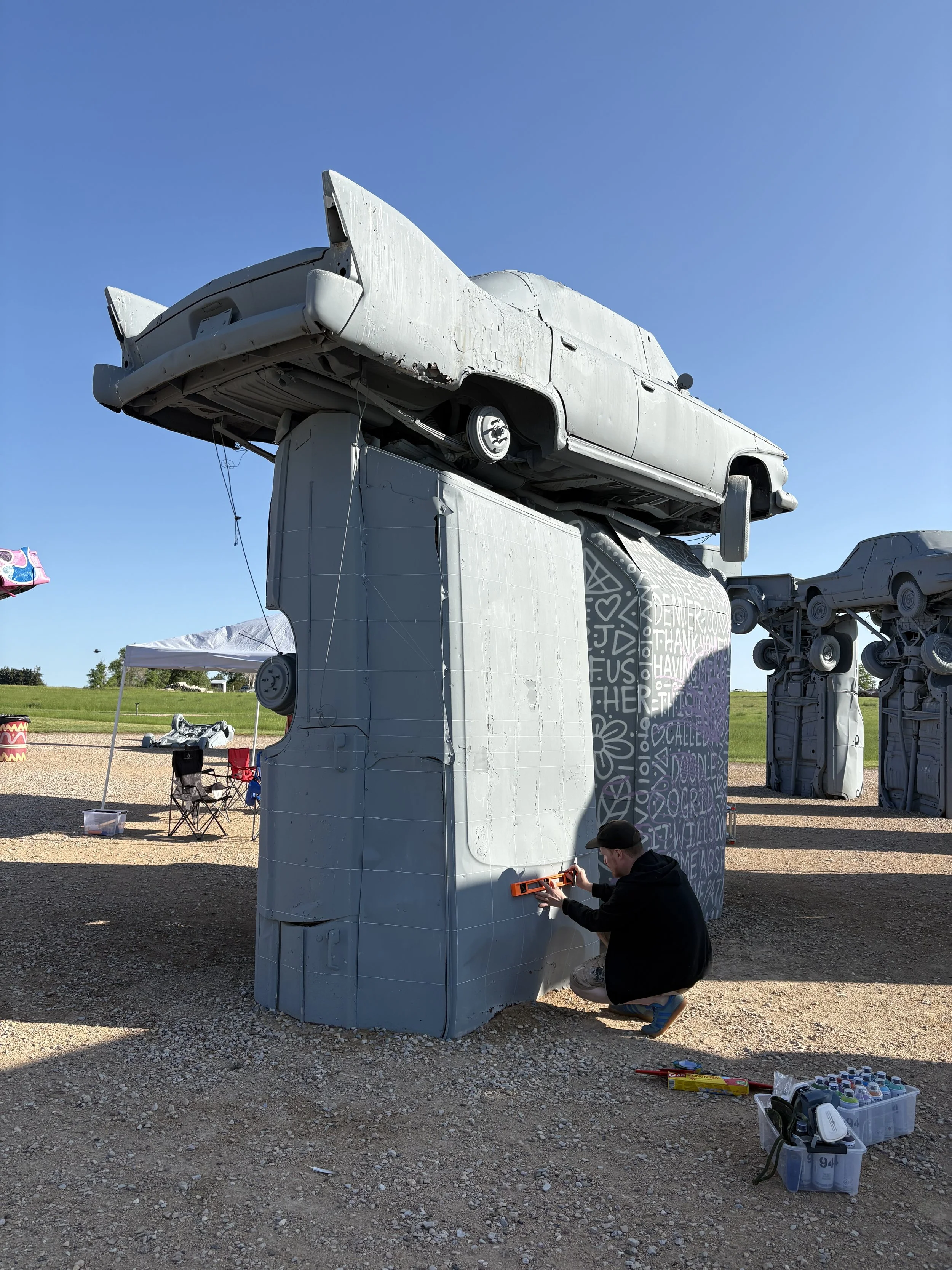 Paul Monster’s in progress mural at the 2025 Carhenge Mural Festival
