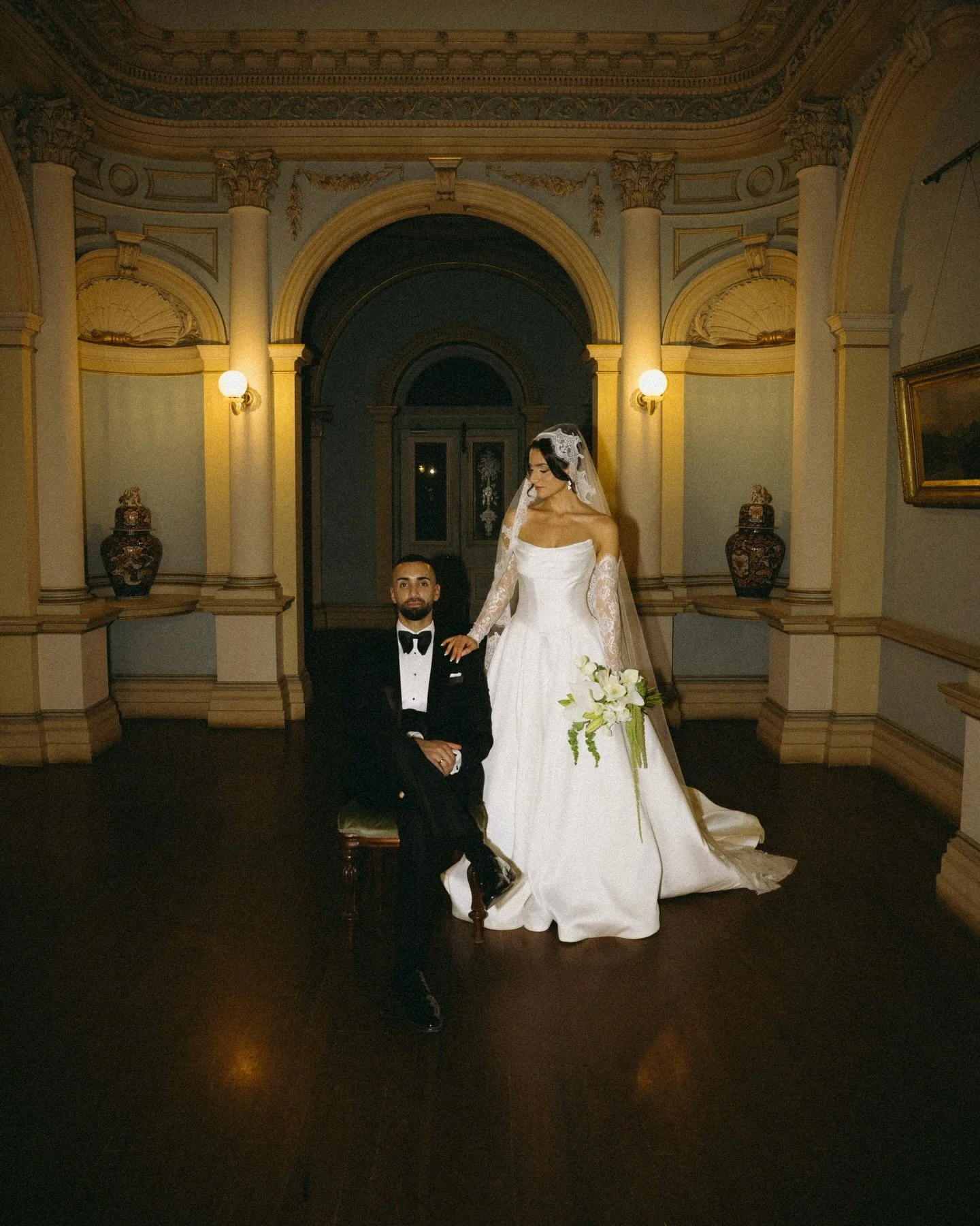 The wedding of Dilara and Deniz.
𝘈 𝘴𝘵𝘶𝘥𝘺 𝘪𝘯 𝘱𝘰𝘪𝘴𝘦.

Set within the ornamented grandeur of Werribee Mansion, the day carried itself with quiet assurance. Every detail belonged, yet nothing overwhelmed - an atmosphere where refinement wasn