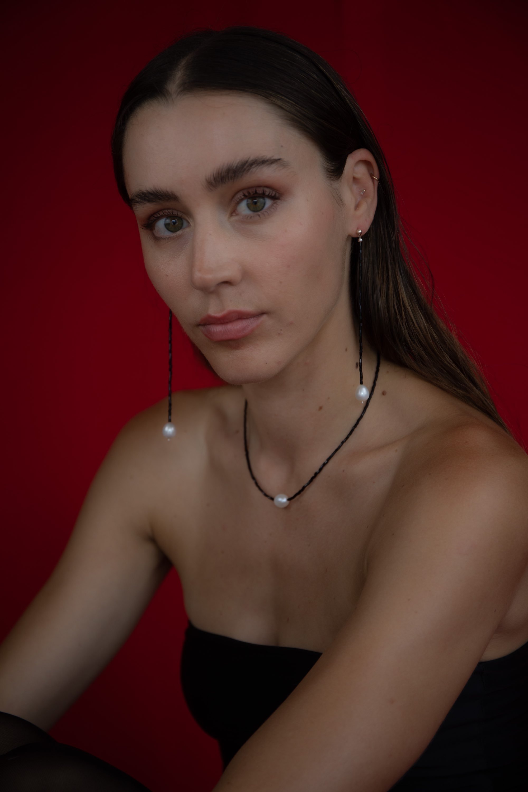 Model wearing Coltrane pearl earrings