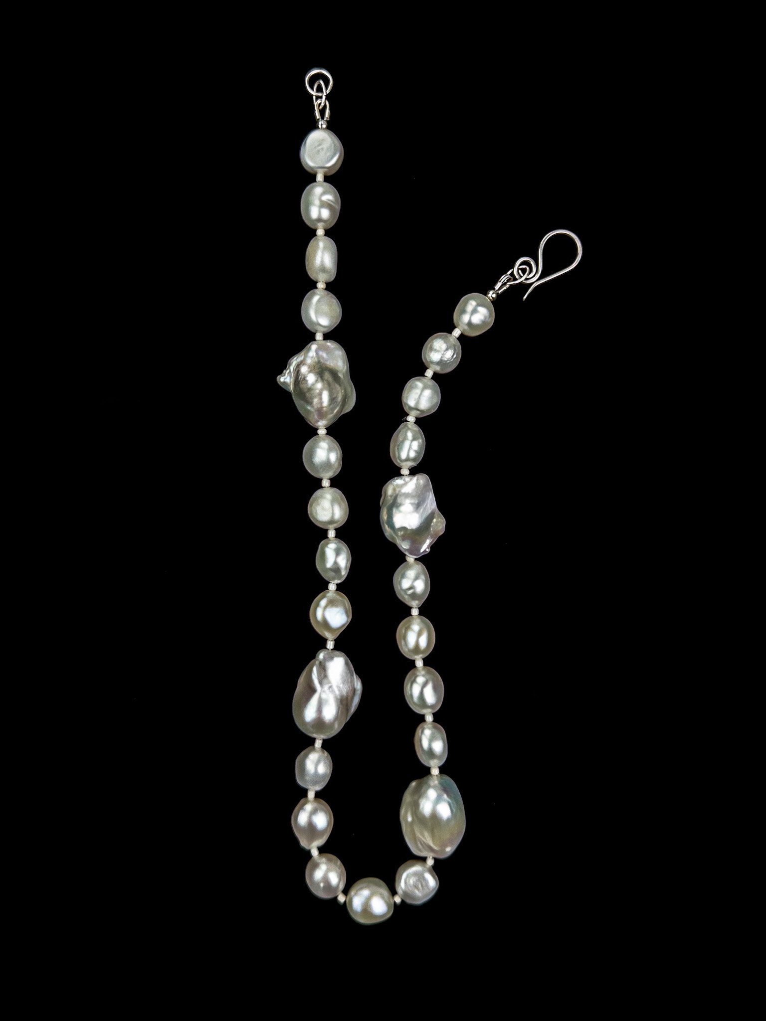 Baroque Pearl Necklace on black background.