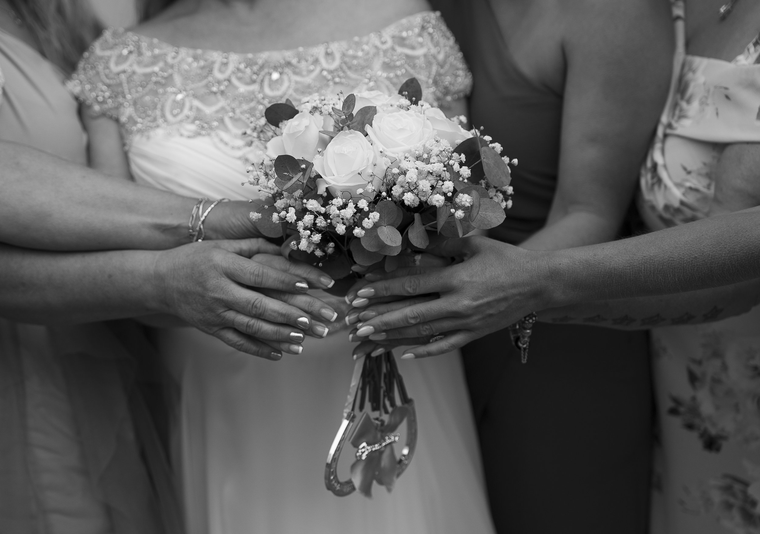 Black and white wedding photography in Brighton and Hove East Sussex holding flowers
