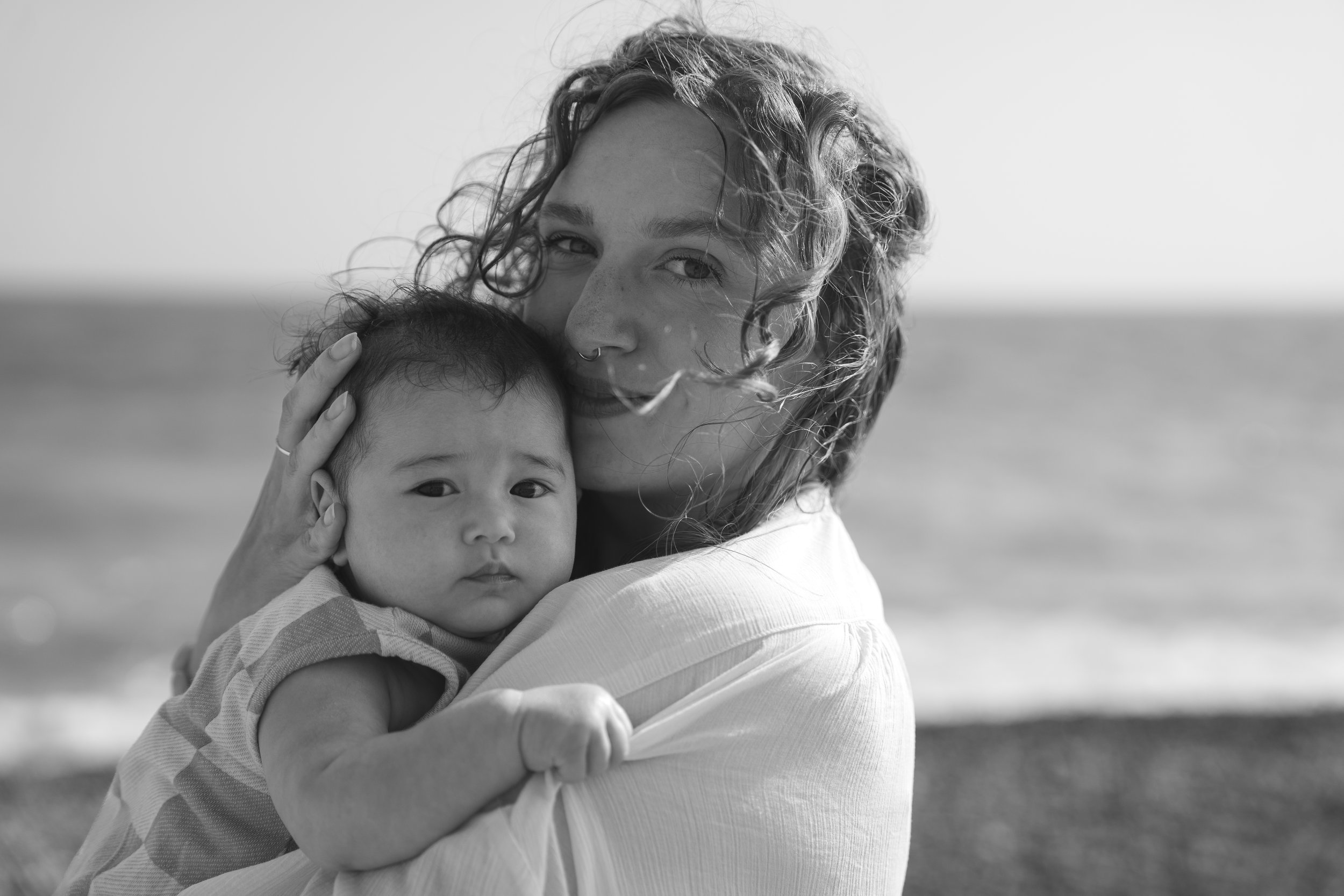 A family photoshoot outdoor family portrait of a mother and baby in Brighton beach Brighton and Hove East Sussex