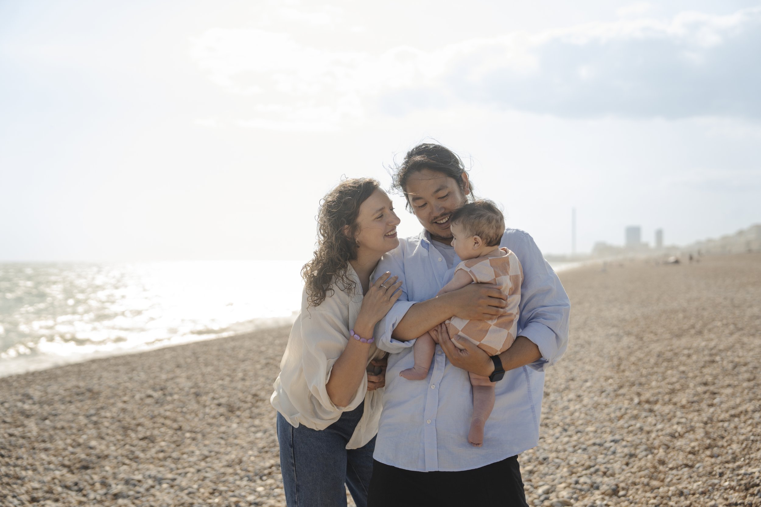 A family photoshoot outdoor family portrait in Brighton beach Brighton and Hove East Sussex