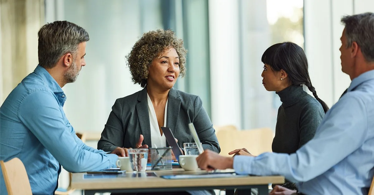 Four diverse business people having a meeting