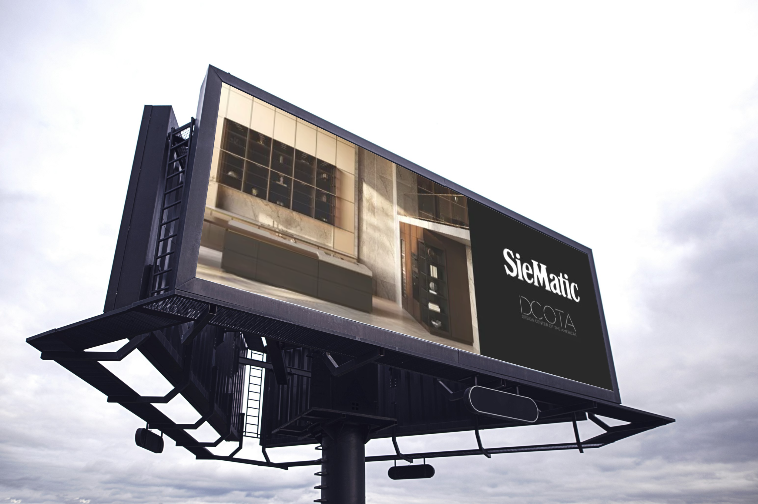 A billboard advertising SieMatic kitchen cabinetry with a reflective image of a modern kitchen, mounted outdoors against a cloudy sky.