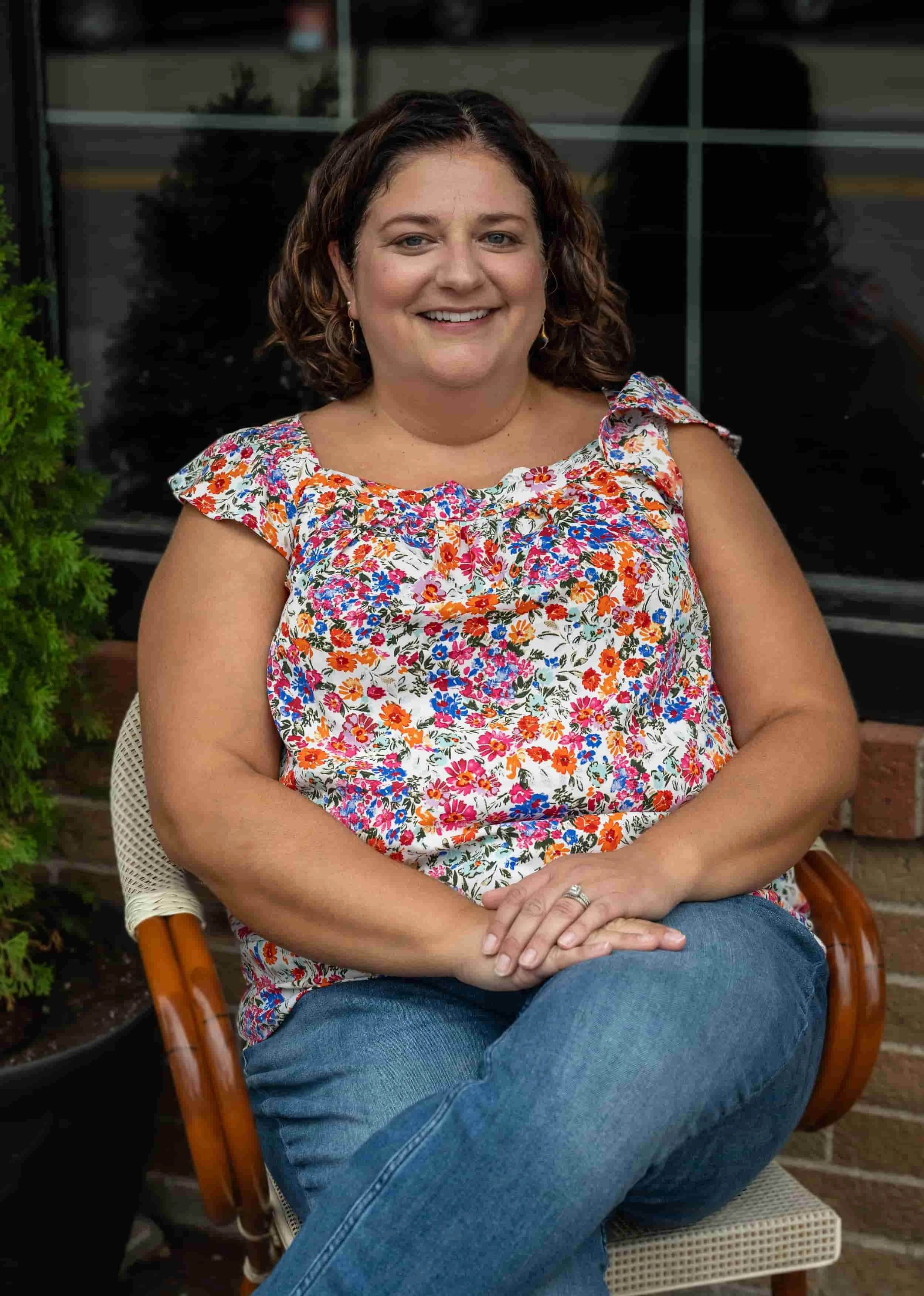 headshot of MacKenzie sitting in a chair
