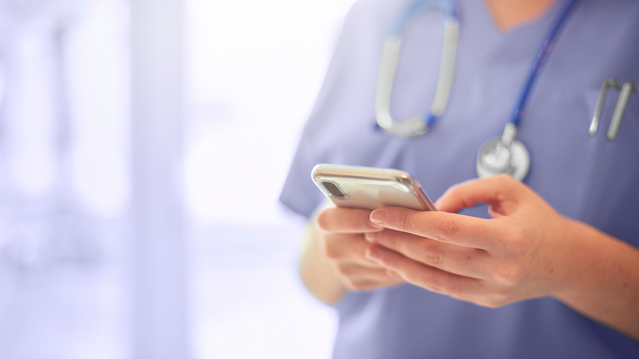 healthcare provider holding cellphone