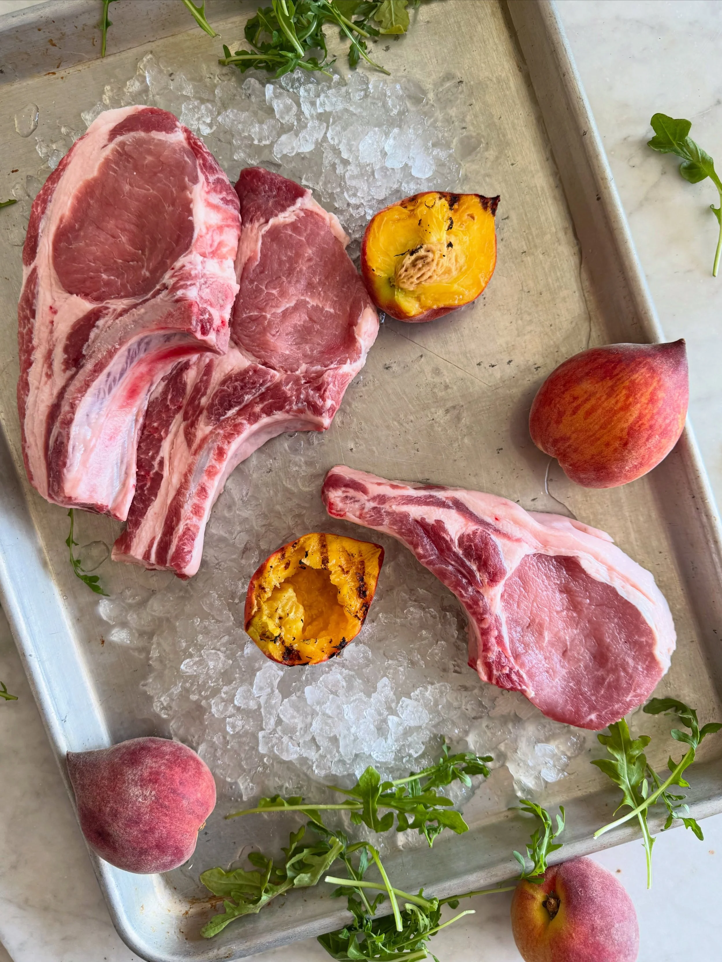 🍑 It&rsquo;s peach szn! 🍑

Come stock up on all your weekend necessities. On our menu? We&rsquo;re dreaming about grilled local @cherrycreekorchards peaches and @homeplacepastures pork chops with a simple arugula salad.

Come shop&mdash;we&rsquo;re