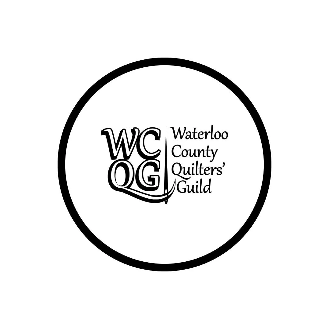 Logo of Waterloo County Quilters' Guild, featuring the initials WCQG inside a circle.