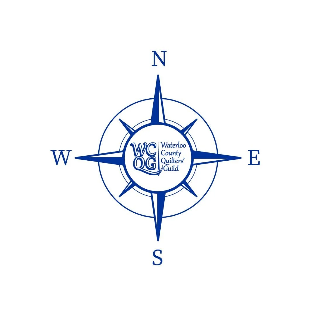 Blue Compass Shape with WCQG replacing the NESW