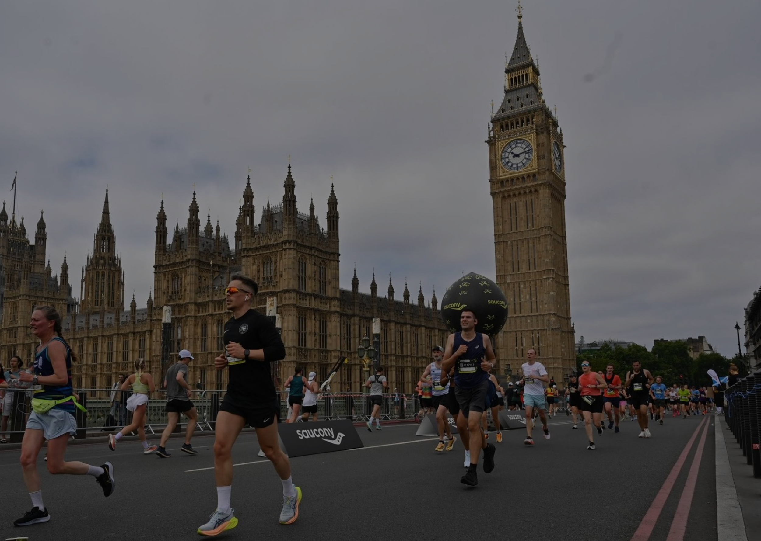 A Notting Hill Running Club member running past big ben.