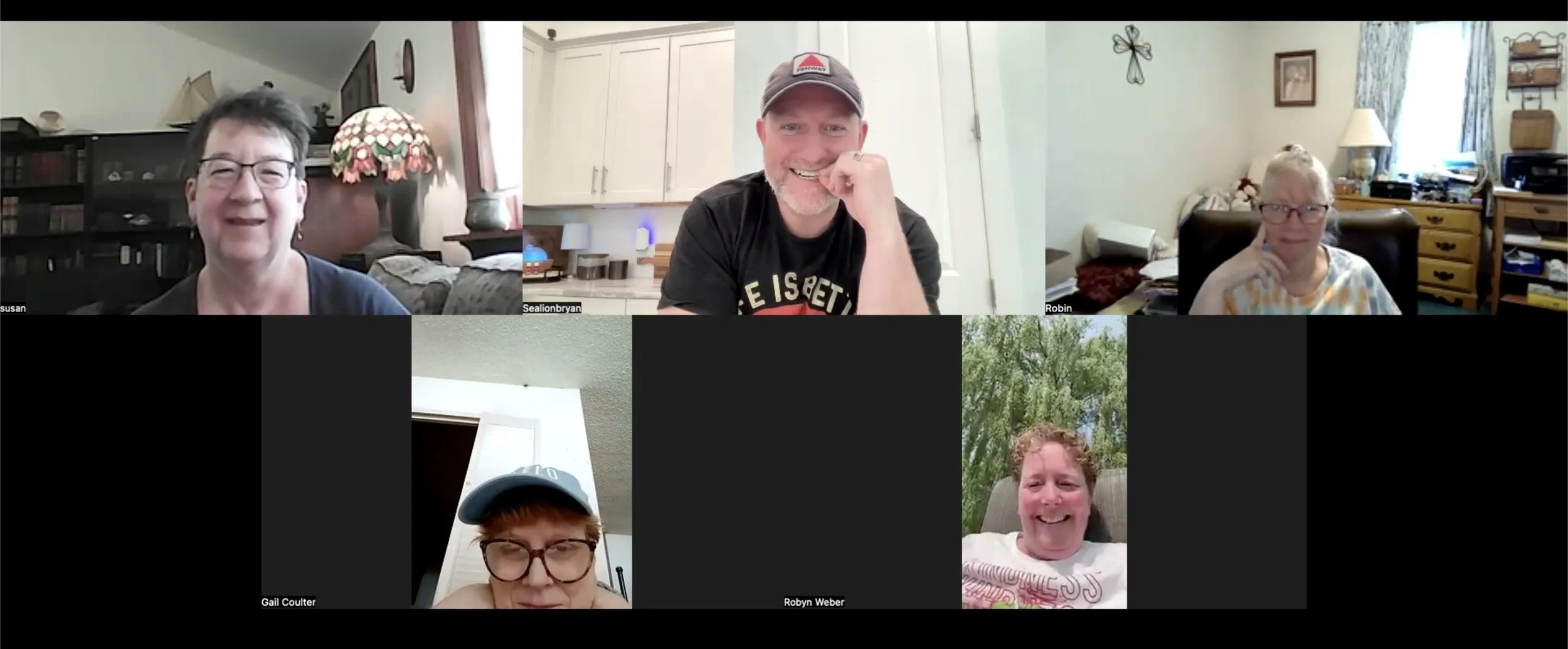 Six people participating in a video call, four women and two men, each in their own home environment, smiling and engaging with each other.
