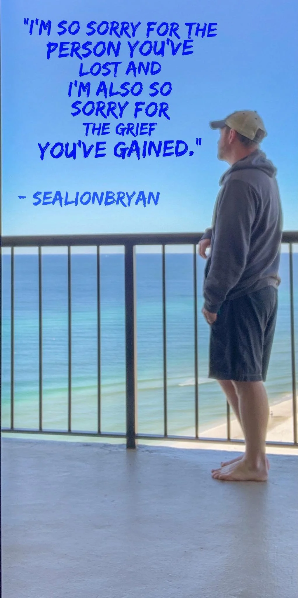 A man in a hoodie, shorts, and a cap standing barefoot on a balcony overlooking the ocean with a quote in blue text about loss and grief by Sealionbryan.