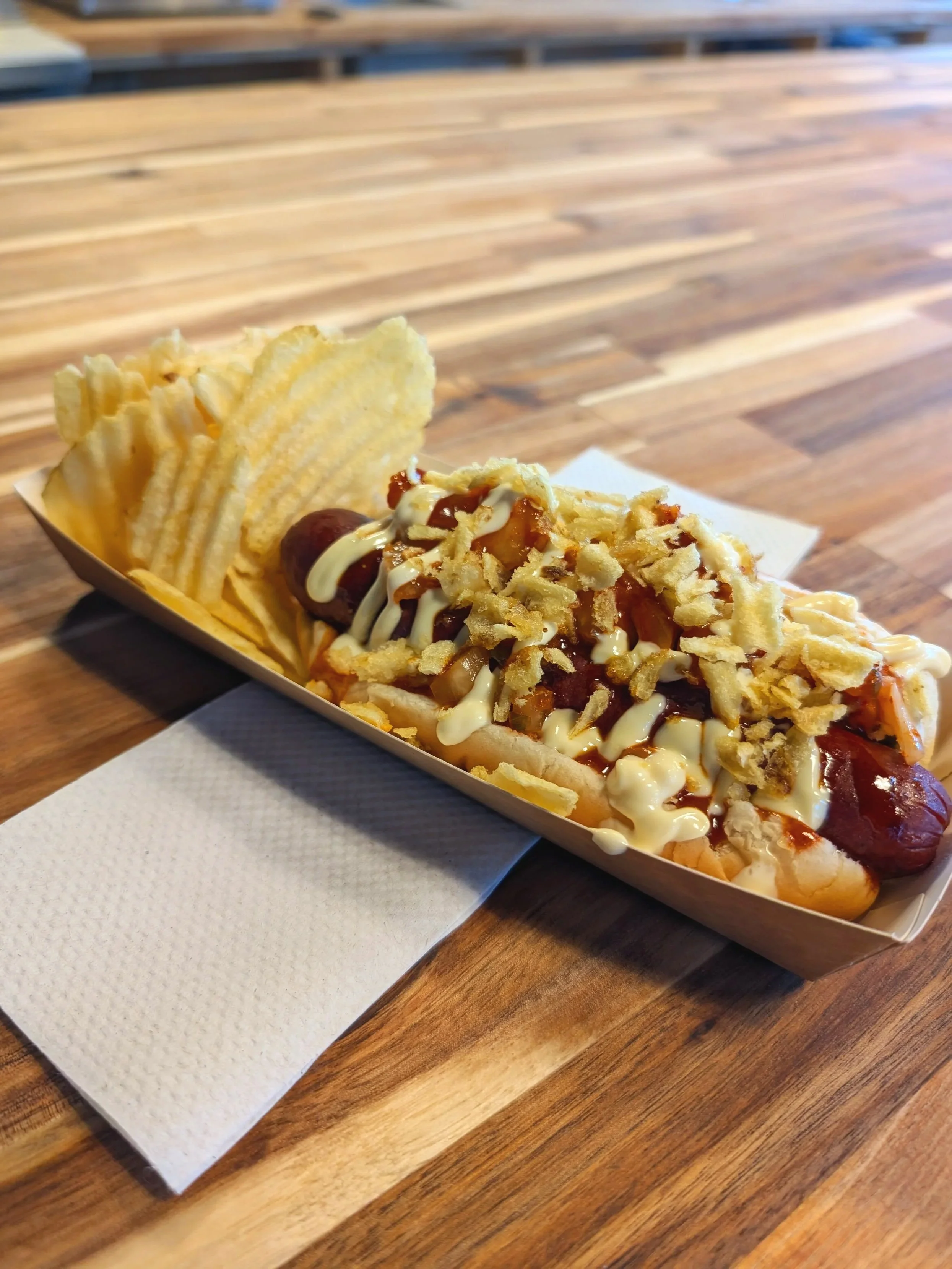 Pacific Rim Hot Dog resting on a butcher block counter