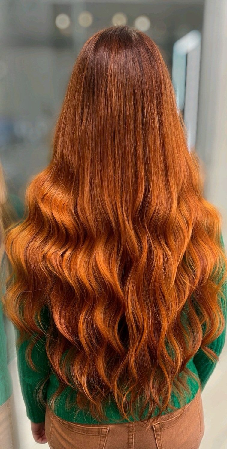 girl with long red hair extensions