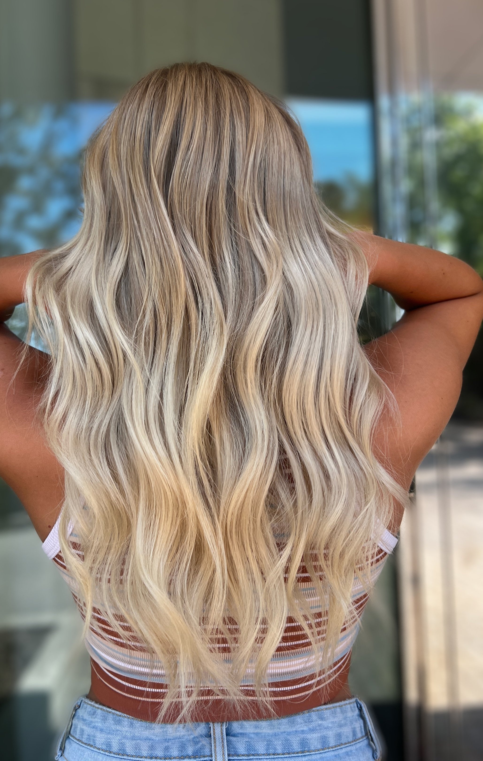 girl with bright blonde highlights long hair
