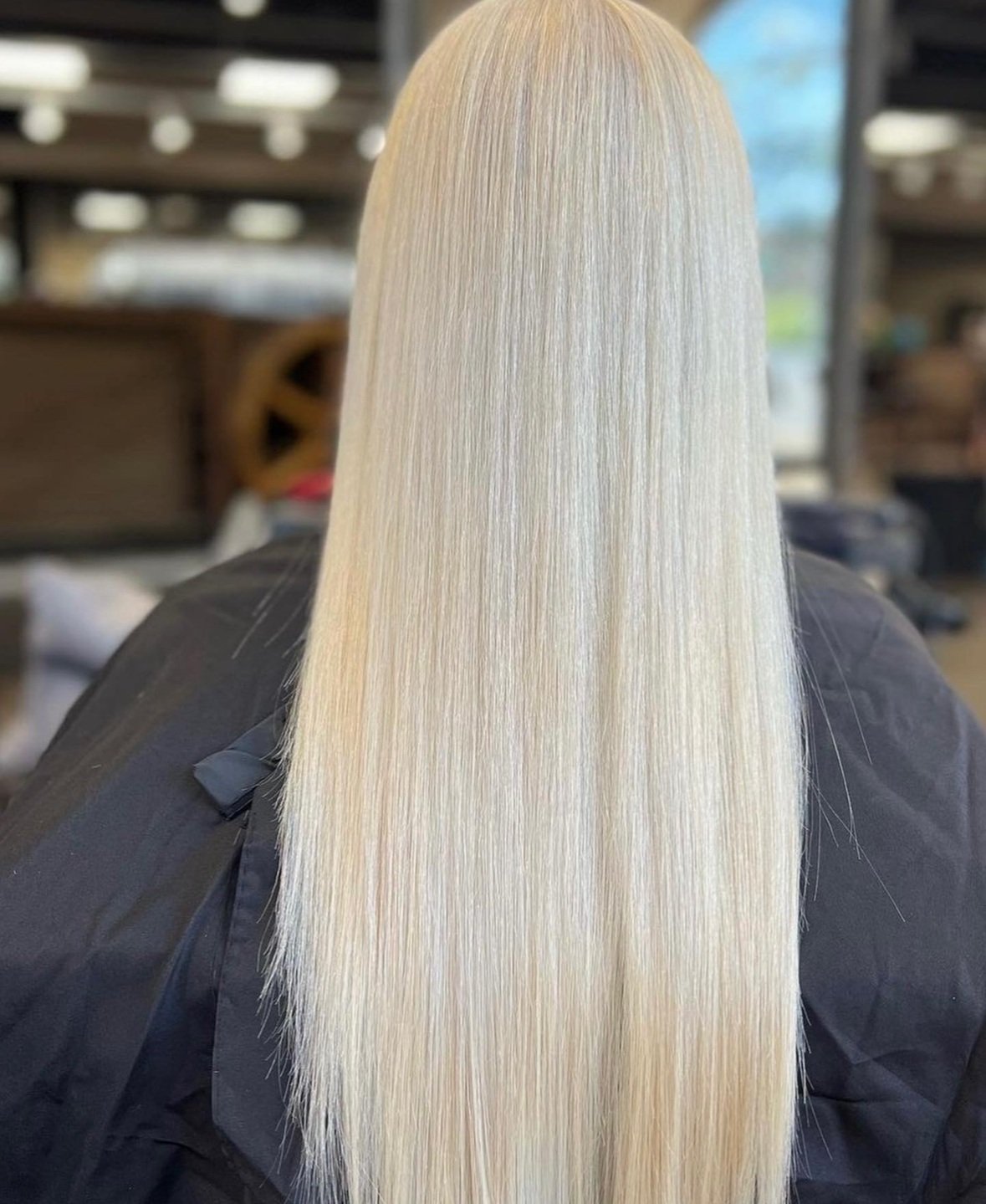 girl with long bright blonde hair straight