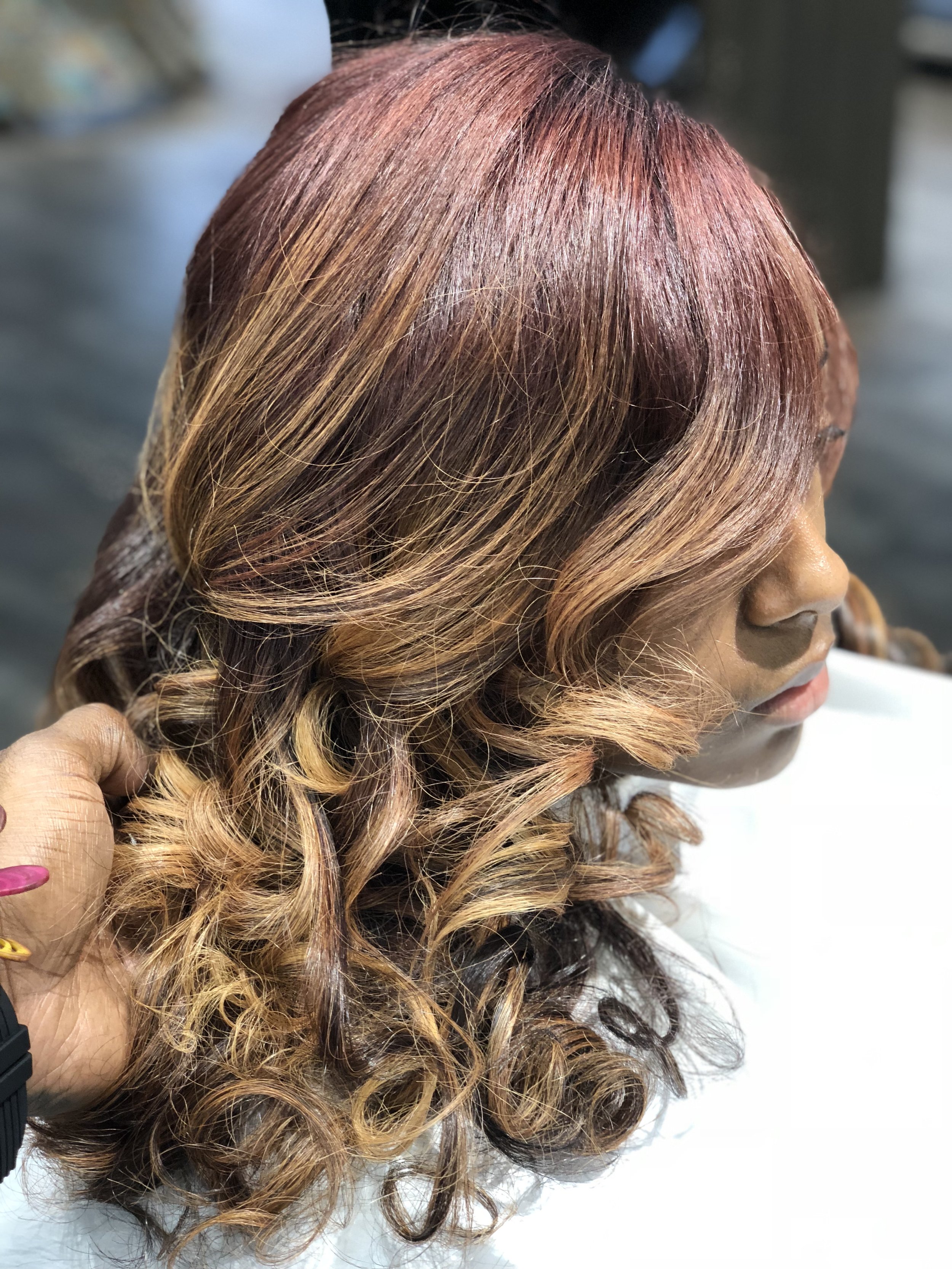 black woman with hair color and curls