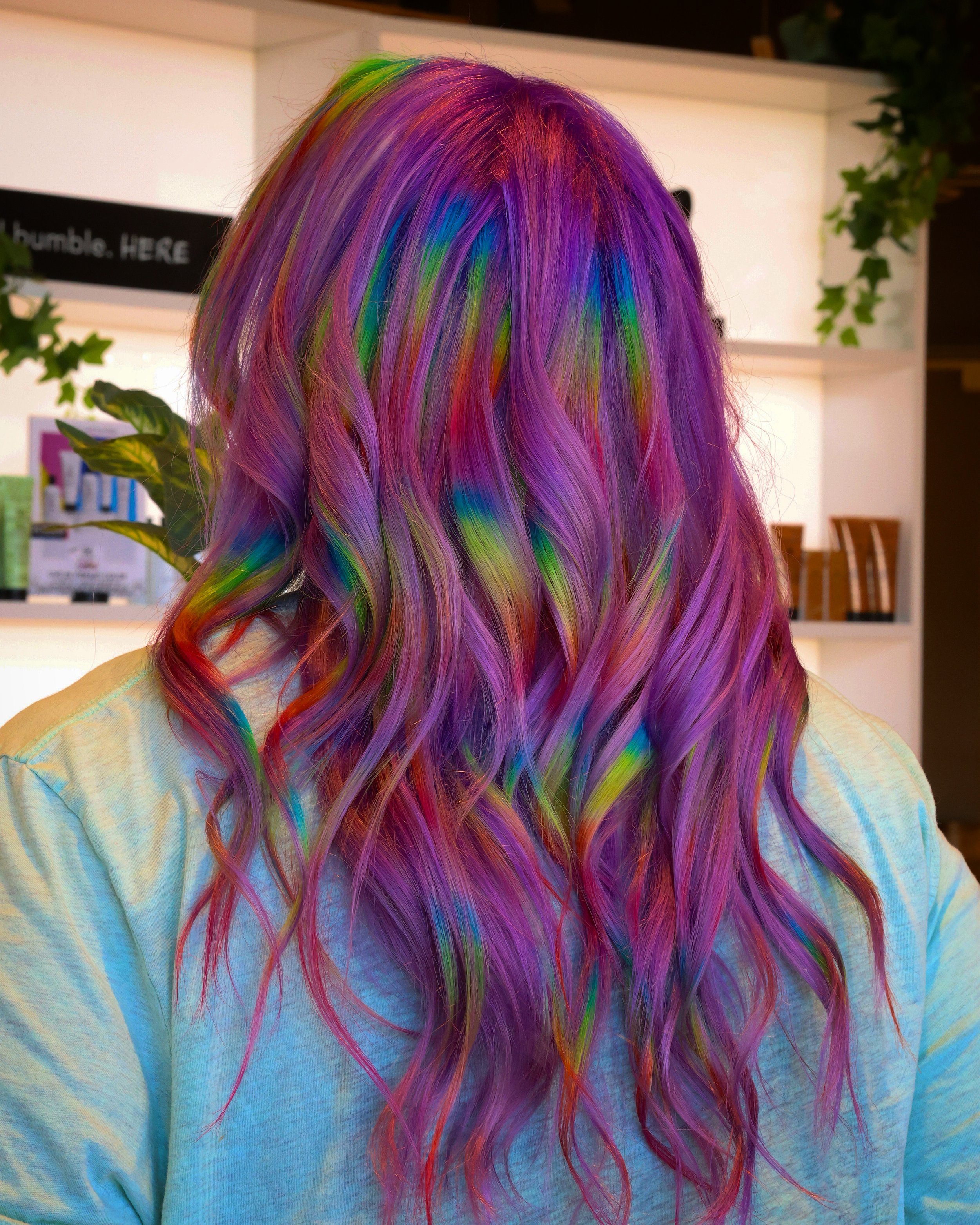 girl with vivid hair color rainbow highlights