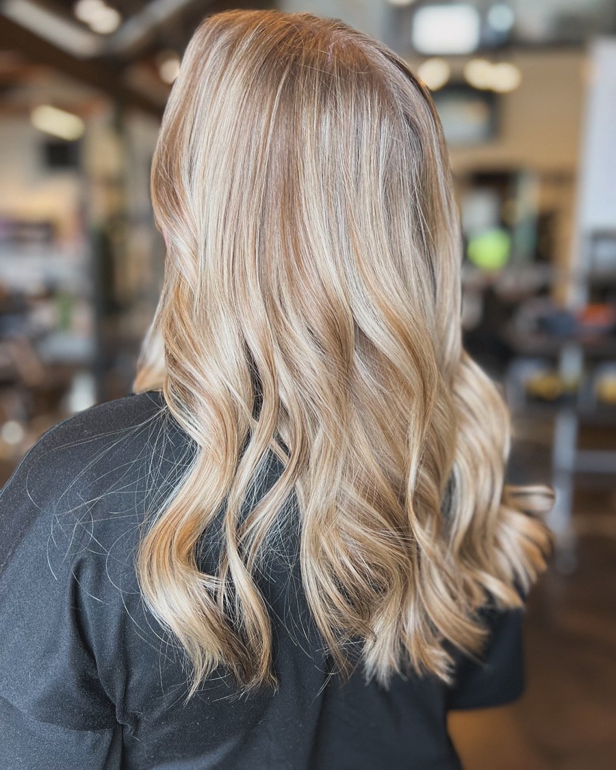girl with blonde highlights in salon