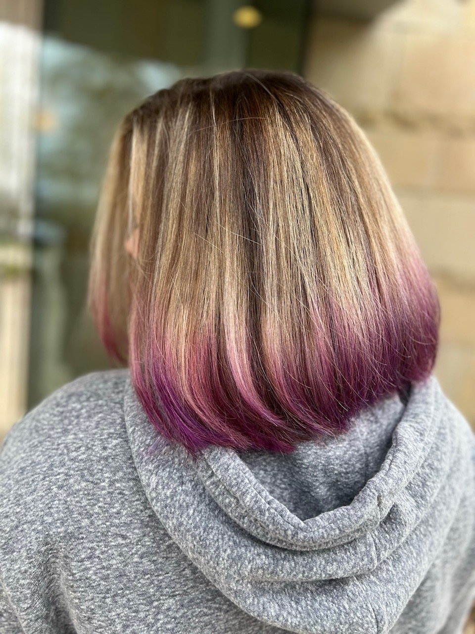 girl with short blonde hair and purple tips