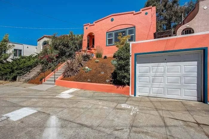 Residential exterior repaint with smooth siding coverage and clean trim lines in the East Bay.