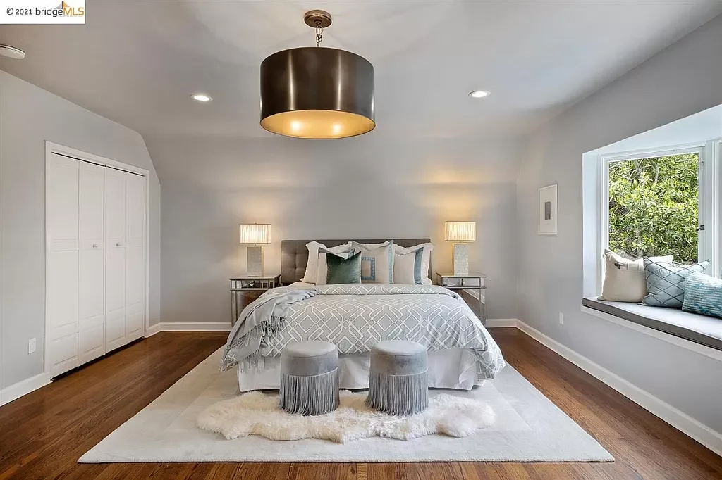 A fresh coat of paint was applied the ceiling, the walls, and the trim to this main bedroom located in the Oakland Hills